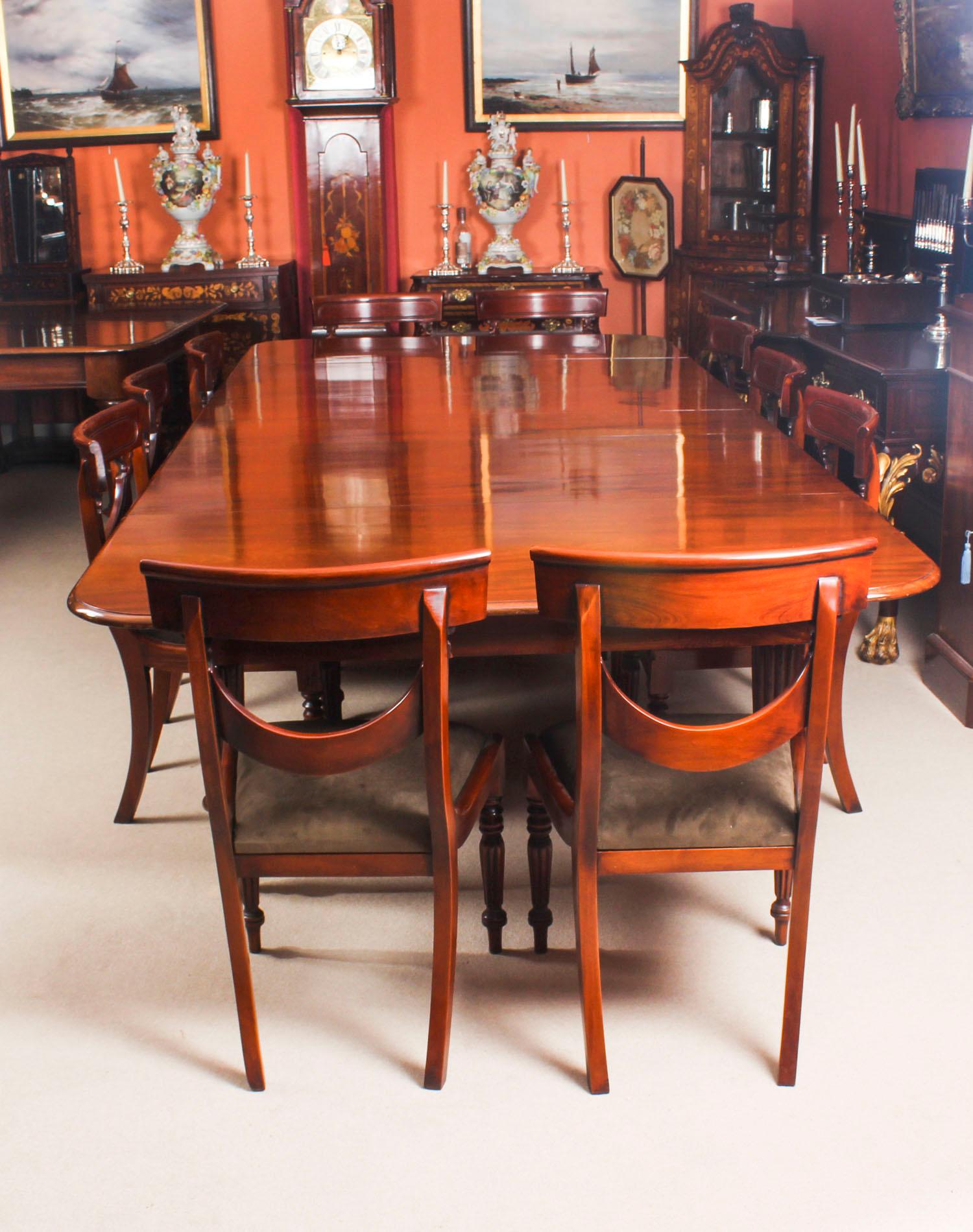 This is a fantastic dining set comprising an antique early Victorian flame mahogany extending dining table, circa 1840 in date, and a set of ten bespoke swag back dining chairs.

This amazing table can sit ten people in comfort and at a stretch up