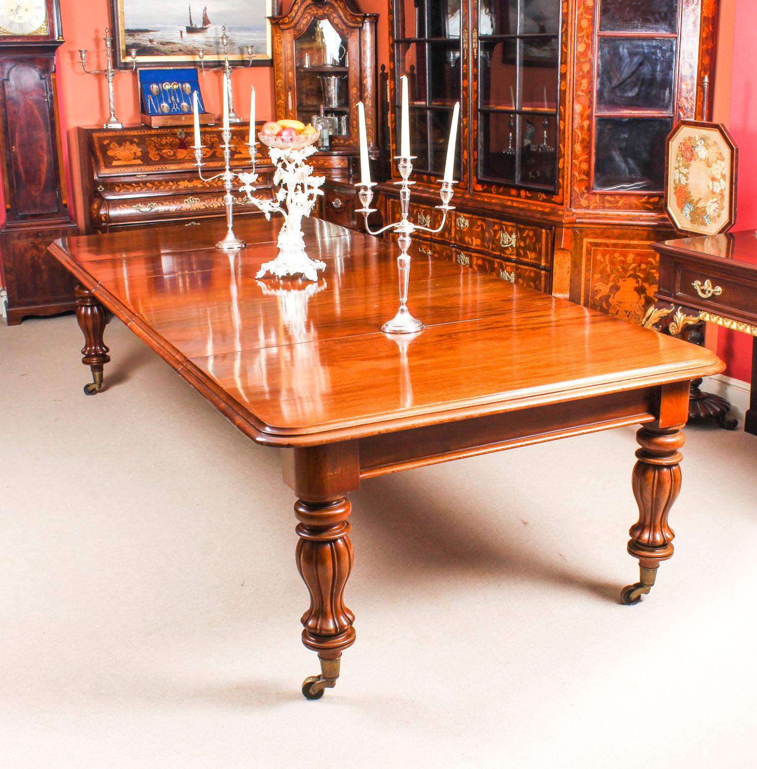 This is a beautiful antique early Victorian flame mahogany extending dining table, circa 1840 in date.

This amazing table can sit twelve people in comfort, has been handcrafted from solid mahogany which has a beautiful grain and is in really