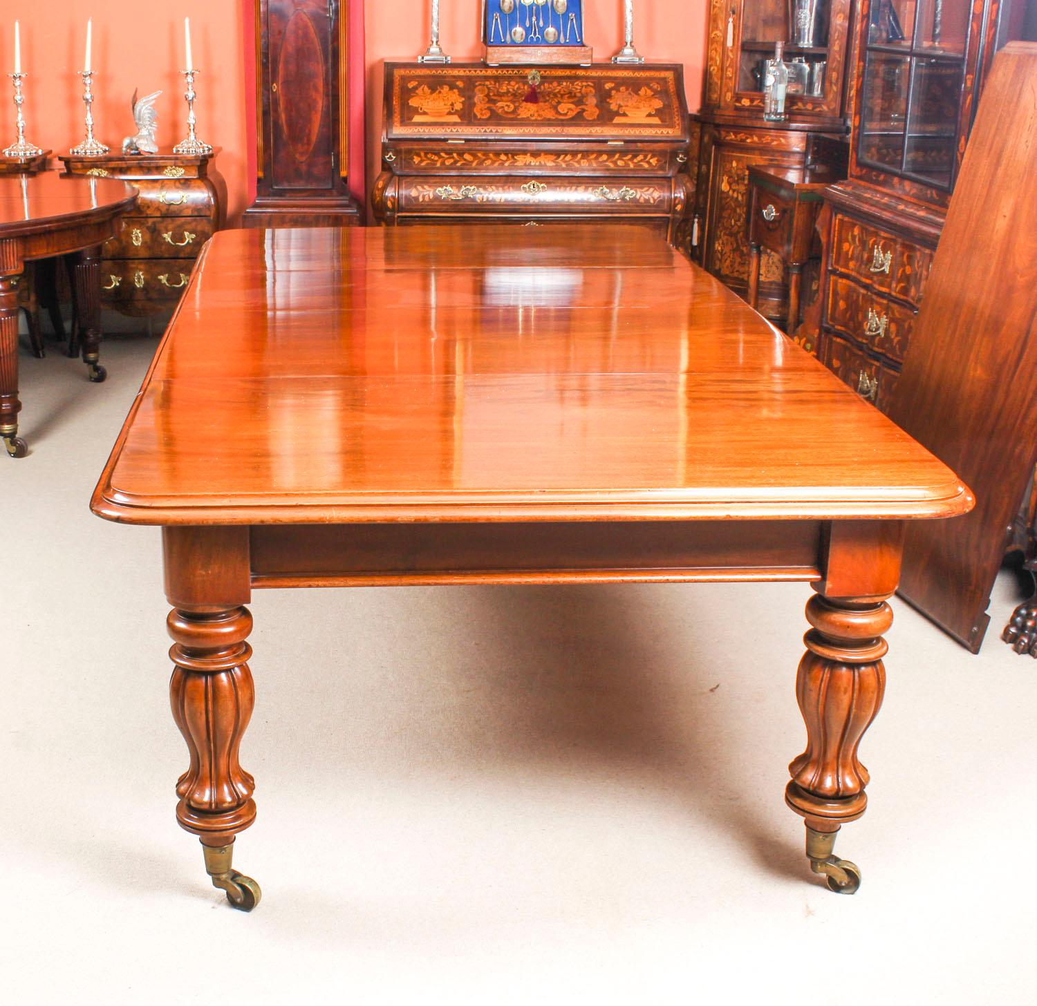 English Antique Flame Mahogany Extending Dining Table, 19th Century