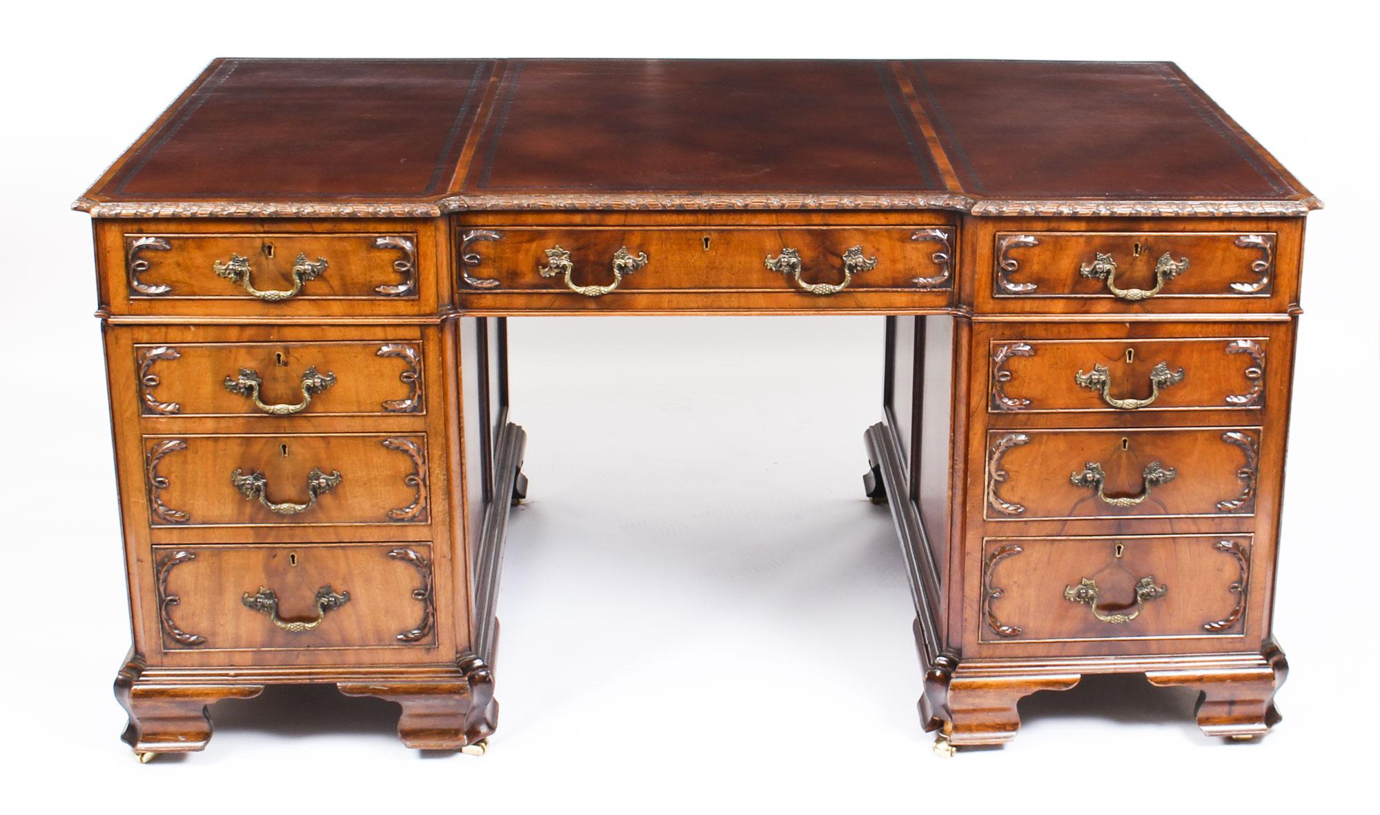 This is a wonderful antique flame mahogany twin pedestal partners desk in the stunning George III manner, circa 1870 in date.
 
The rectangular desk is of inverted breakfront outline and the top features an inset three part blind tooled tan
