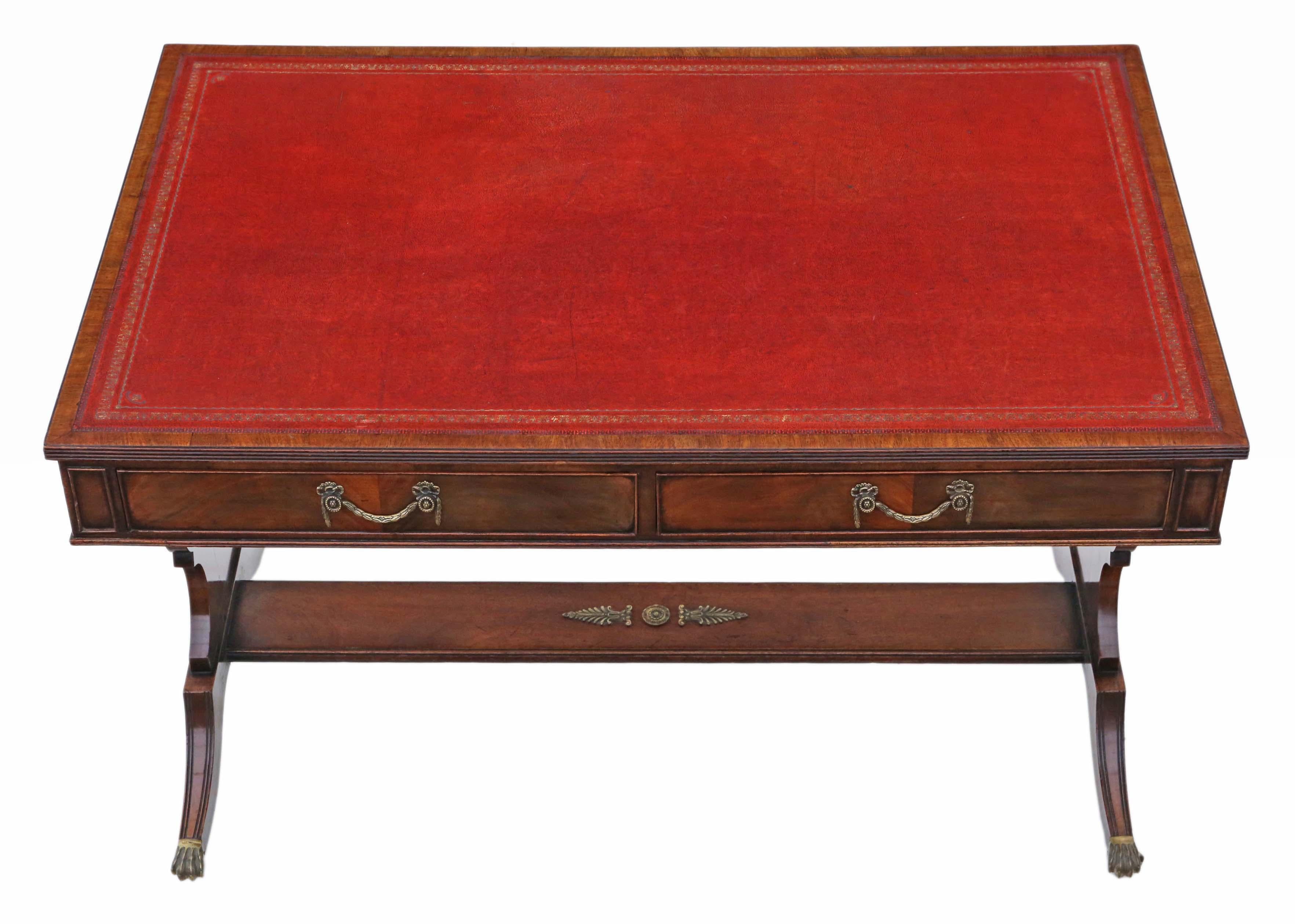 Antique quality flame mahogany writing table or desk 19th century revival, C1920.

No loose joints. Full of age, character and charm. The drawers slide freely. A rare and attractive find. The oak lined drawers slide freely.

Patinated tooled