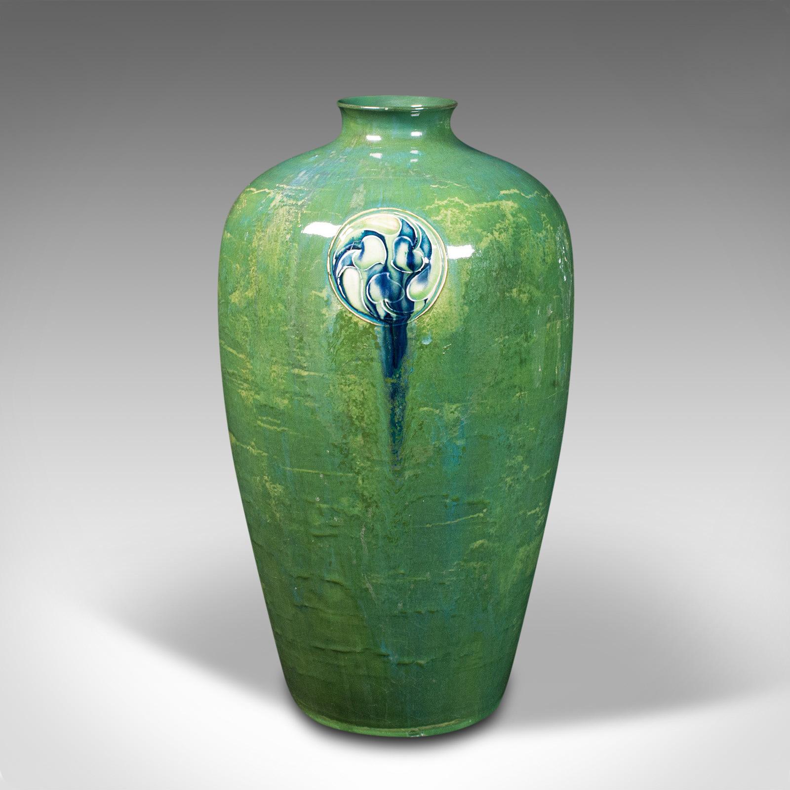 This is an antique Flaminian vase. An English, ceramic baluster flower vase in Art Nouveau taste by William Moorcroft (1872-1945) for Liberty of London, dating to the Edwardian period, circa 1910.

Striking example of Edwardian art