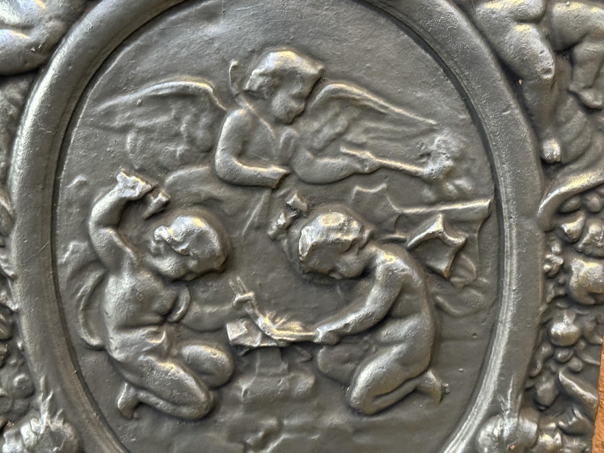 Iron Antique Flemish 'Cupids with Decoration' Fireback / Backsplash For Sale