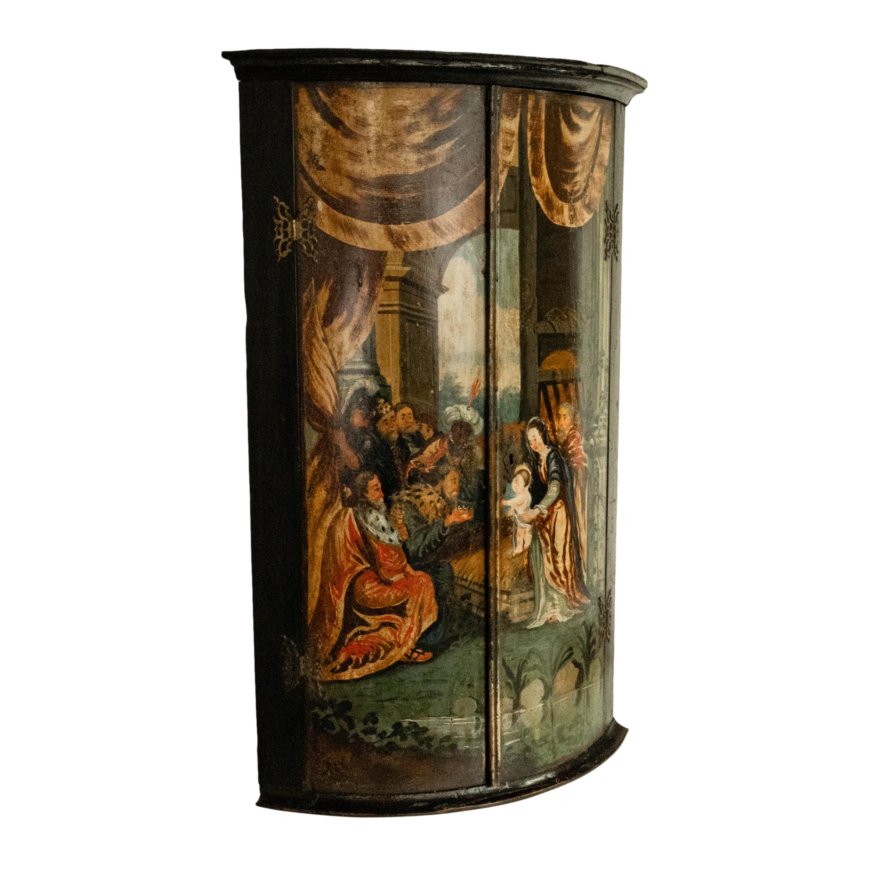 A rare antique Flemish/Dutch polychrome corner cabinet, painted with the nativity scene of Jesus, Holland circa 1760.
The two door bow-fronted cabinet having an original painting of the Adoration of the Christ Child