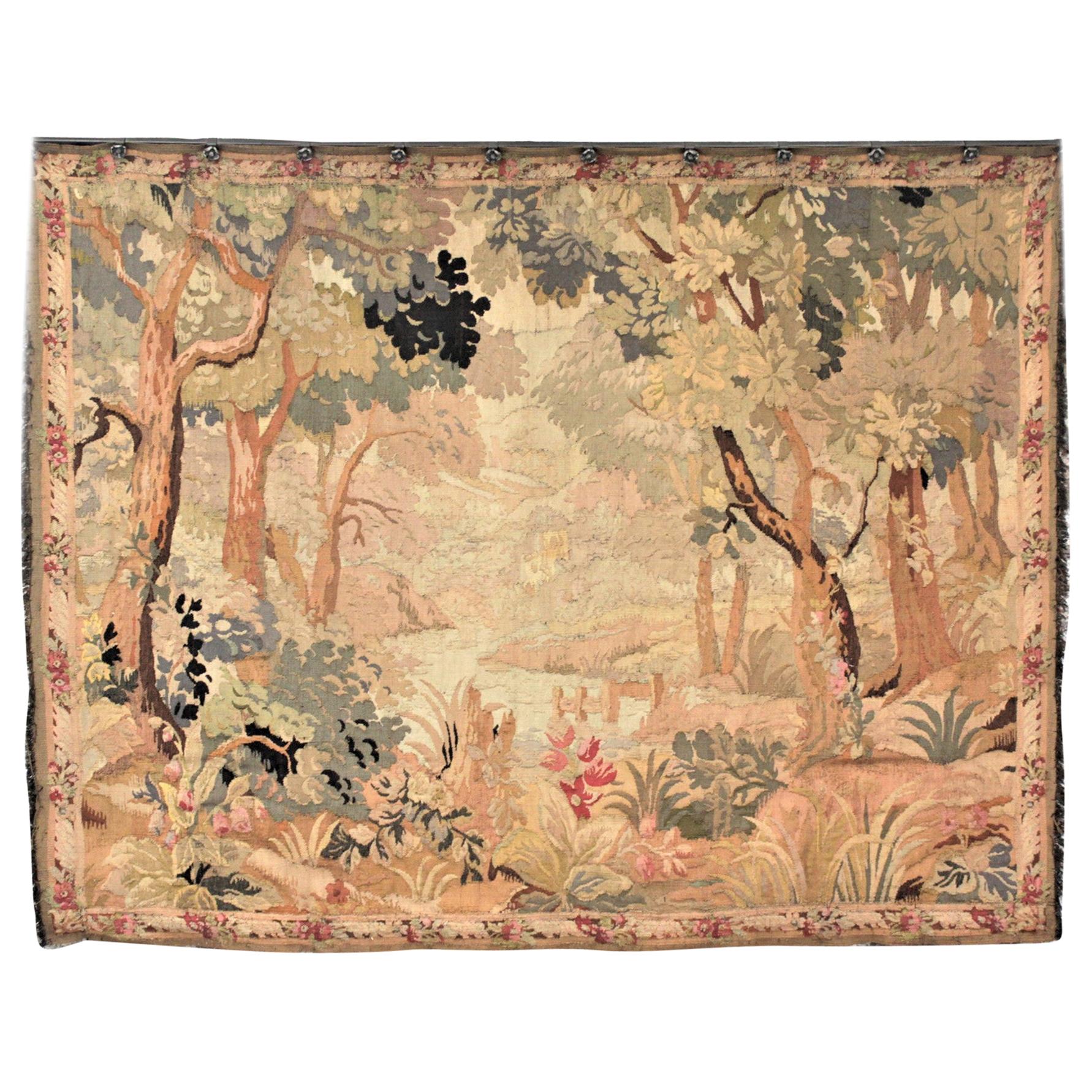 Antique Flemish Verdure Styled Hand Knotted Tapestry of a Lush Forest & Lake