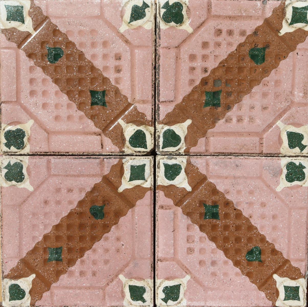 A batch of 86 reclaimed encaustic cement floor tiles. These tiles will cover 3.44 m2 or 37 sq. ft. They are suitable for use on floors or walls.Weathered surfaces and small chips associated with transport and storage.

 Good overall condition.