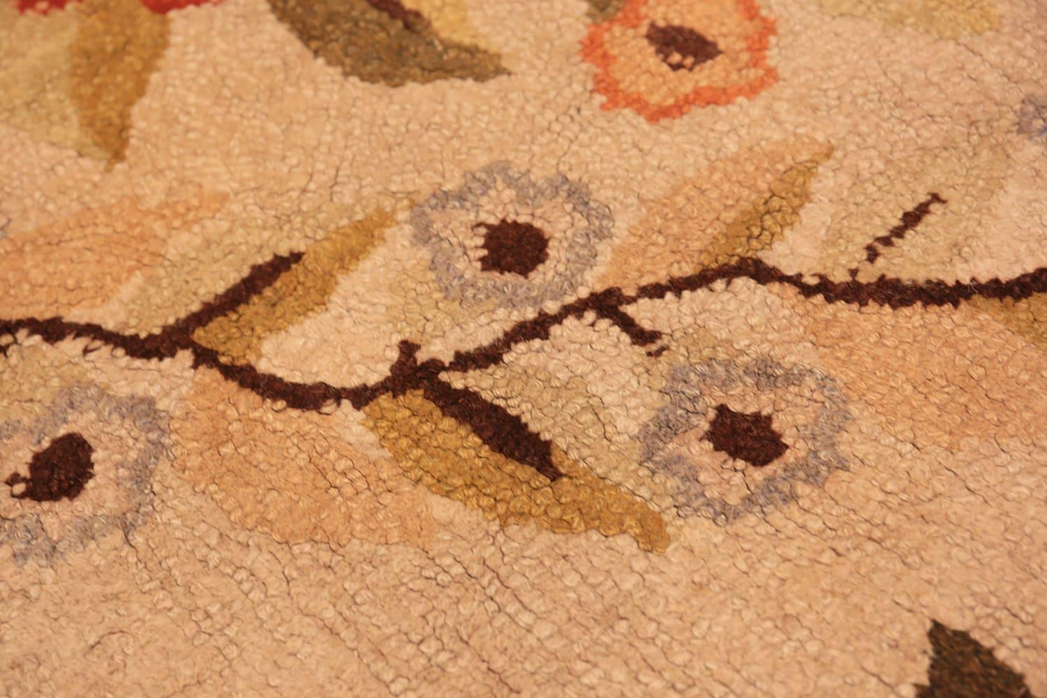 Floral antique American hooked rug, Country of origin: America, Circa date: 1900. Size: 5 ft 11 in x 8 ft 11 in (1.8 m x 2.72 m). 

