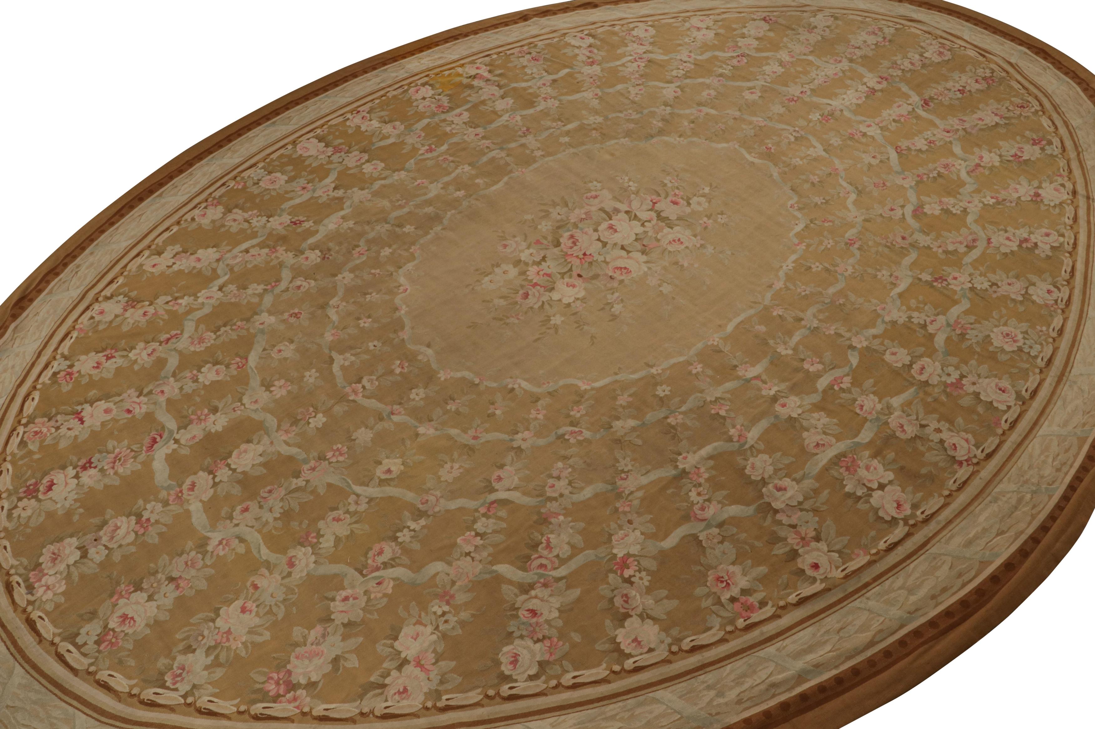 Handwoven in wool, circa 1890-1900, this 13x18 antique Aubusson flatweave and oversized rug is a rare oval-shaped curation from  its period. 

On the design: 

Originating from France during the late 19th century, this oval rug features a rich brown