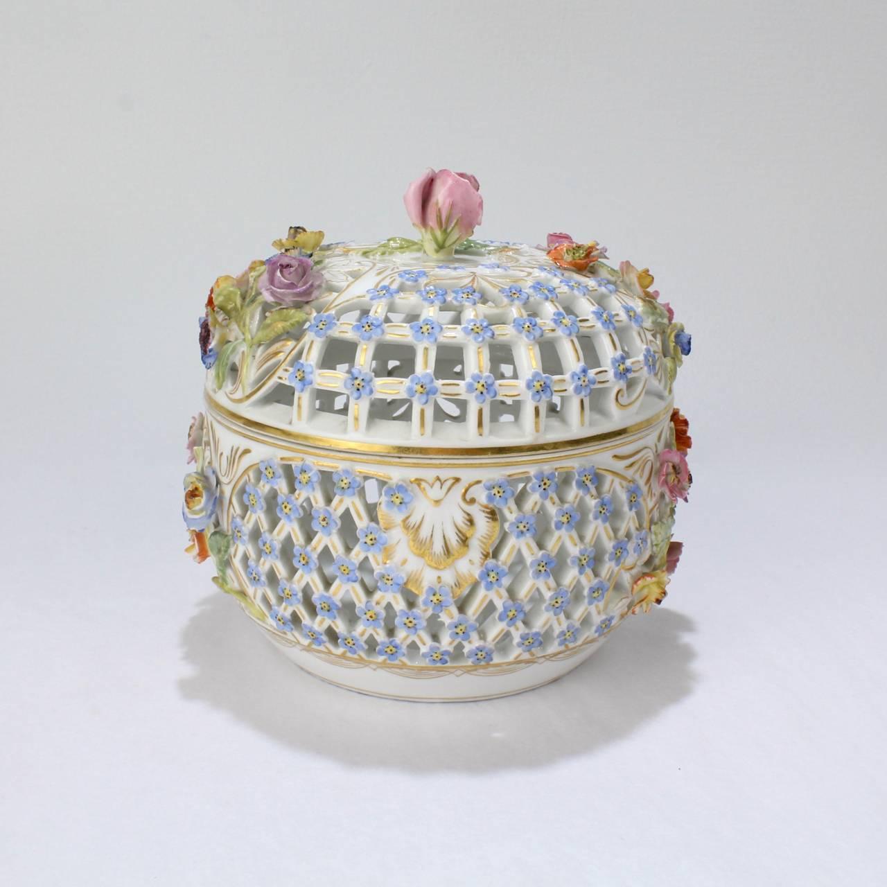 A good, antique flower encrusted dresser box with openwork from the Carl Teichert Meissen factory. 

The base bears a blue underglaze script Meissen mark and a faint 'Made in Germany' mark.

Diameter: ca. 5 5/8 in.


    