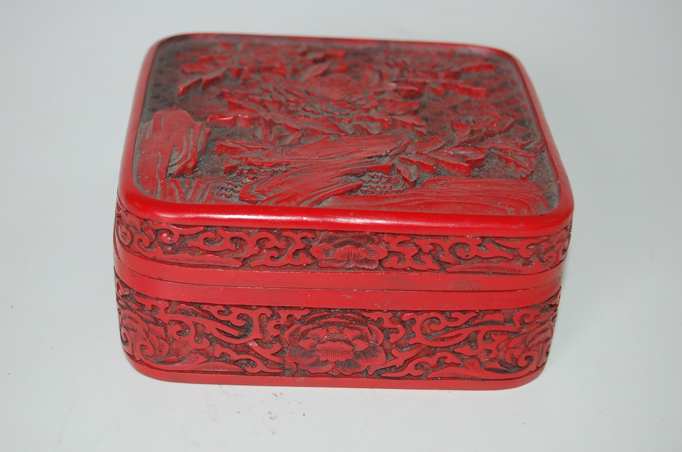 Antique floral hand carved lacquer cinnabar lidded jewelry box.