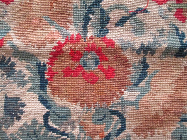 Antique floral needlepoint seat cover tapestry fragment.
Depicting large blooming flowers.
In shades of gold, green, red, black and brown.
Ideal for upholstery or pillow.
Size: 19
