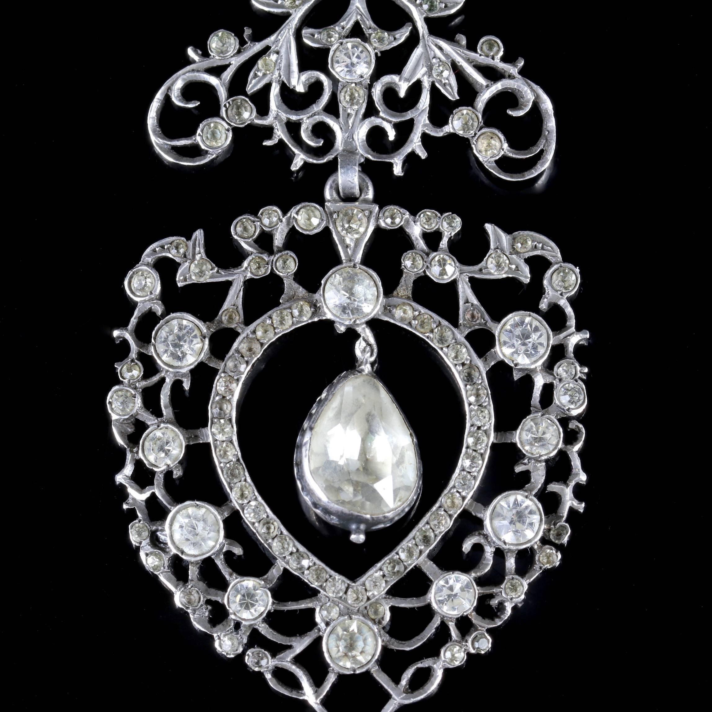 



The pendant is adorned with sparkling Paste Stones with a centre Paste dropper which hangs freely.

The floral design of the pendant looks wonderful, it shows fabulous workmanship of its time.

Paste is a heavy, very transparent flint glass that