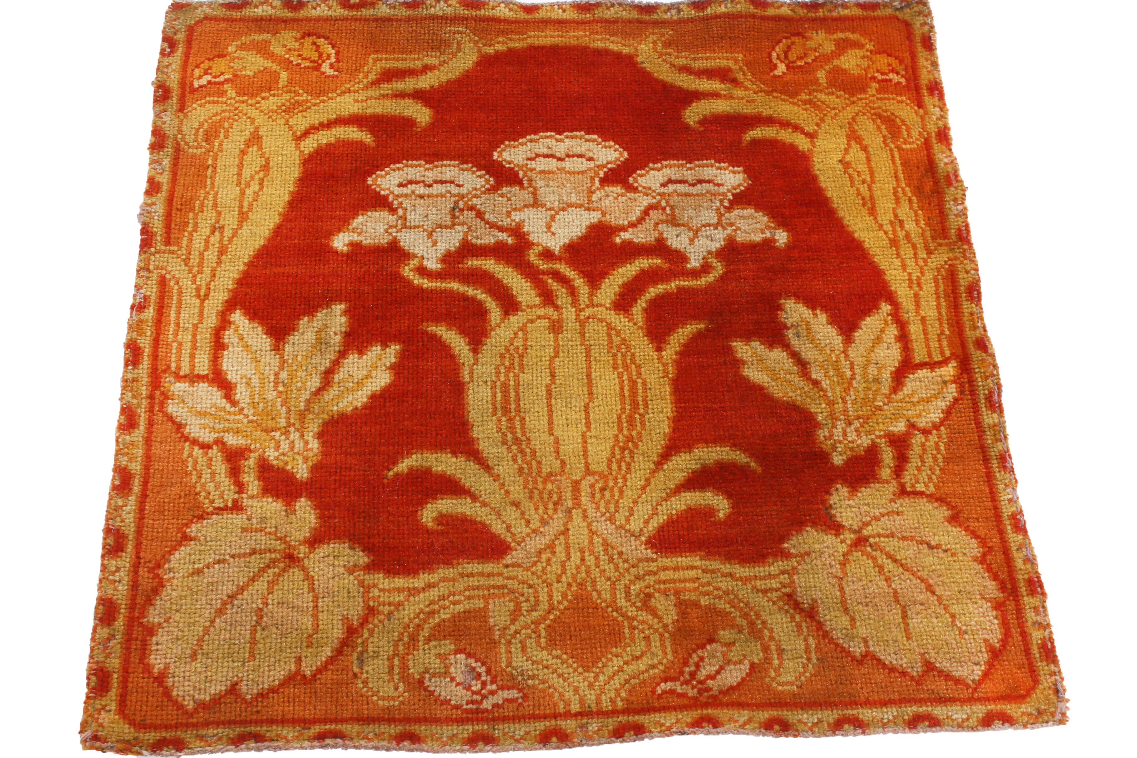 Hand knotted with luminous silk in a near-perfect square body, this antique floral rug originates from the United States between 1910-1920, featuring a gentle and bold combination of red, cream, and peach color ways lending warm, regal tones to a