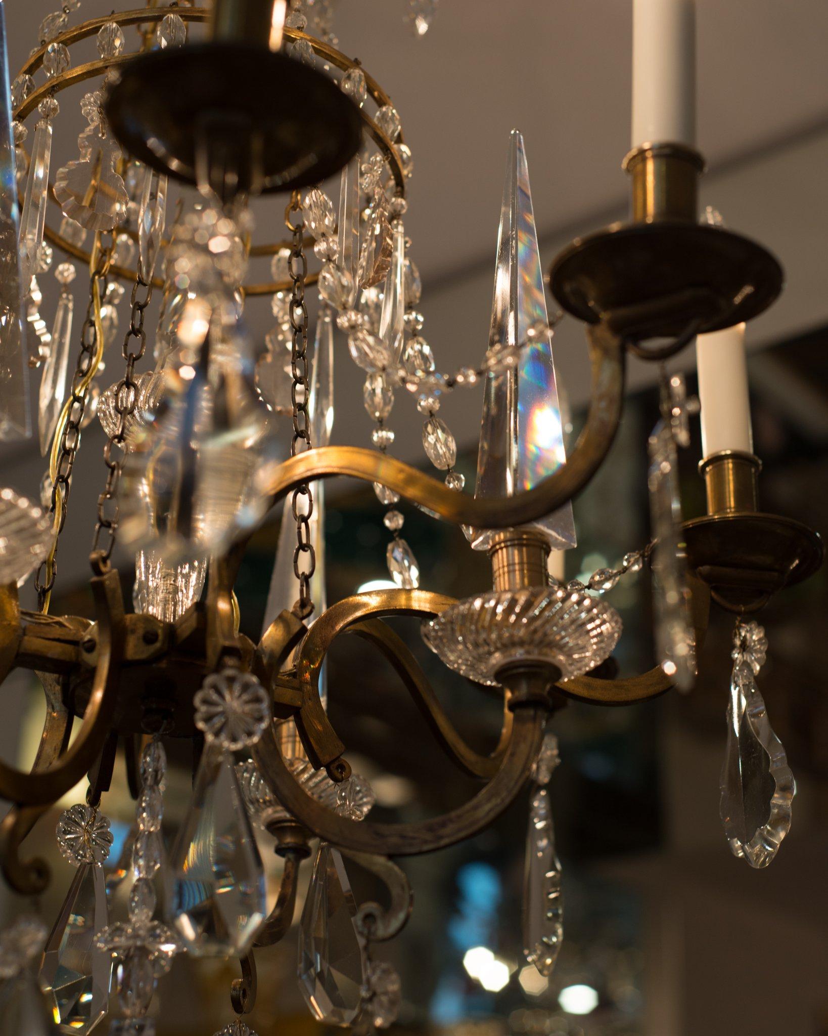 This antique Florentine crystal chandelier was discovered on a trip to Florence, Italy. Three large pyramid crystals among the candles make this specific chandelier such a rare and exceptional find. It has been newly rewired for North American