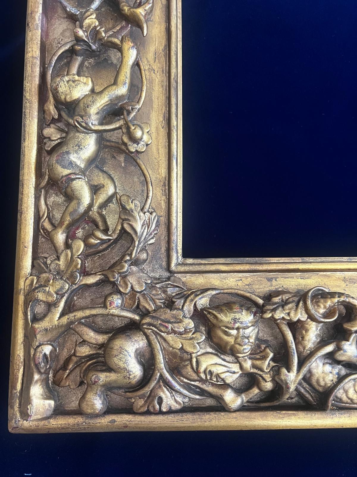 An extraordinary 19th century Florentine Renaissance Revival gilt wood frame, masterfully carved in ash wood and richly gilded, embodying the opulent tradition of Florentine and Venetian craftsmanship.
This exceptional frame is alive with deeply