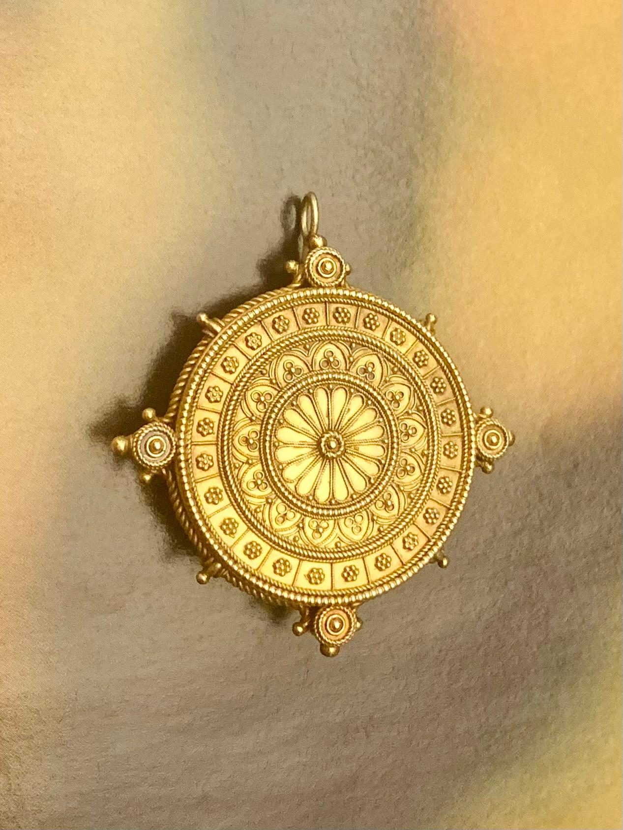Exceptional quality, on par with the finest Castellani pieces, antique Etruscan Revival large 14K yellow gold locket pendant/brooch
19th Century
Featuring superb granulation and wirework techniques for which the Etruscan Revival period is justly