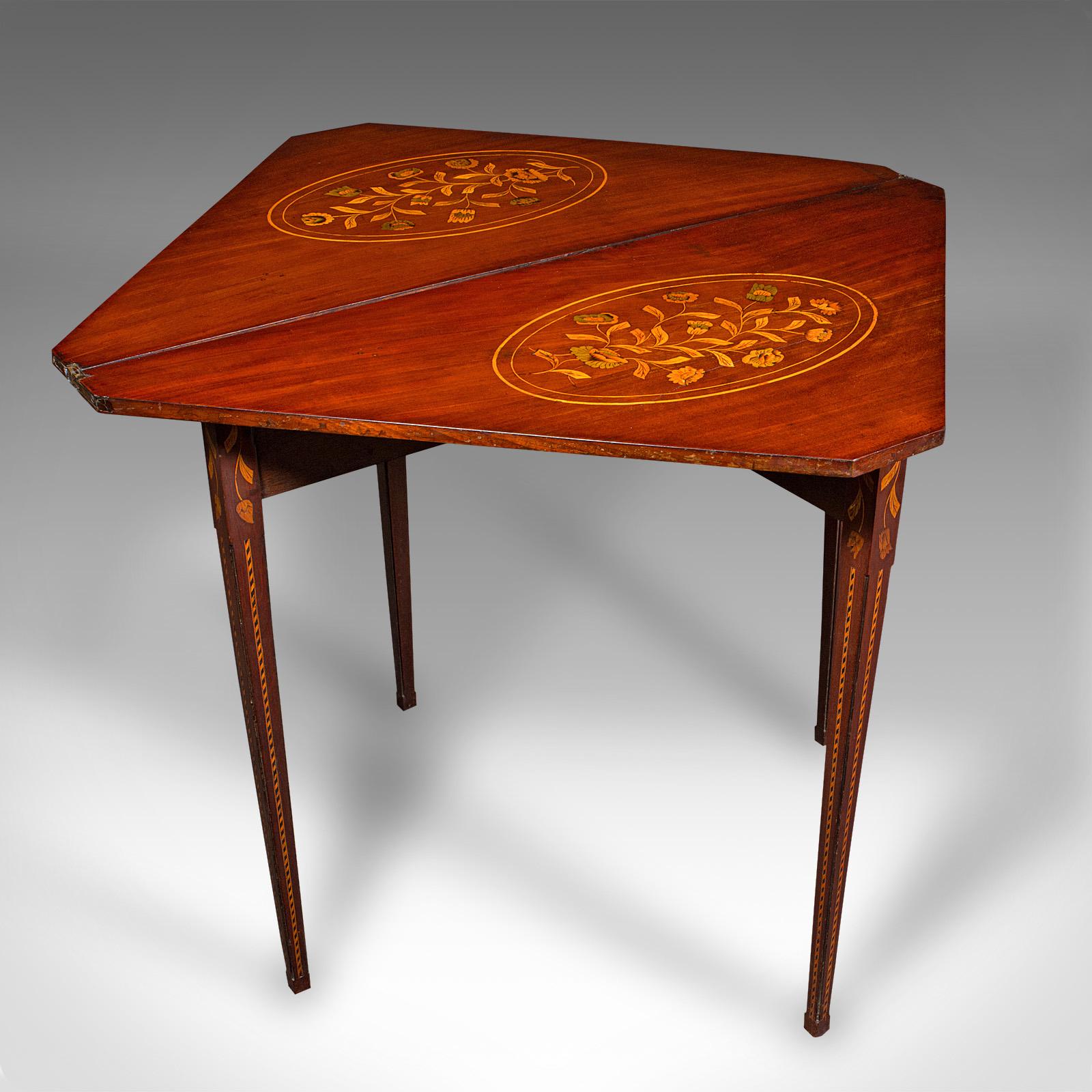 This is an antique flower display table. A Dutch, mahogany and inlaid fold-over gate leg console table, dating to the Georgian period, circa 1780.

Captivating craftsmanship with exceptional colour and detail
Displays a desirable aged patina and in