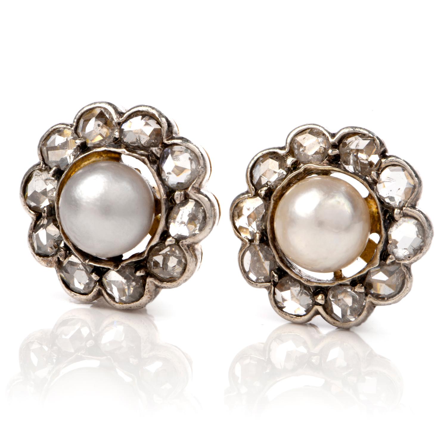 These whimsical flower earrings are crafted in a combination of –karat white and yellow gold. Depicting small flowers with a pair of pearls measuring 6mm in diameter, simulating the flower bud. Petals are simulated by 24 rose-cut bezel set diamonds,