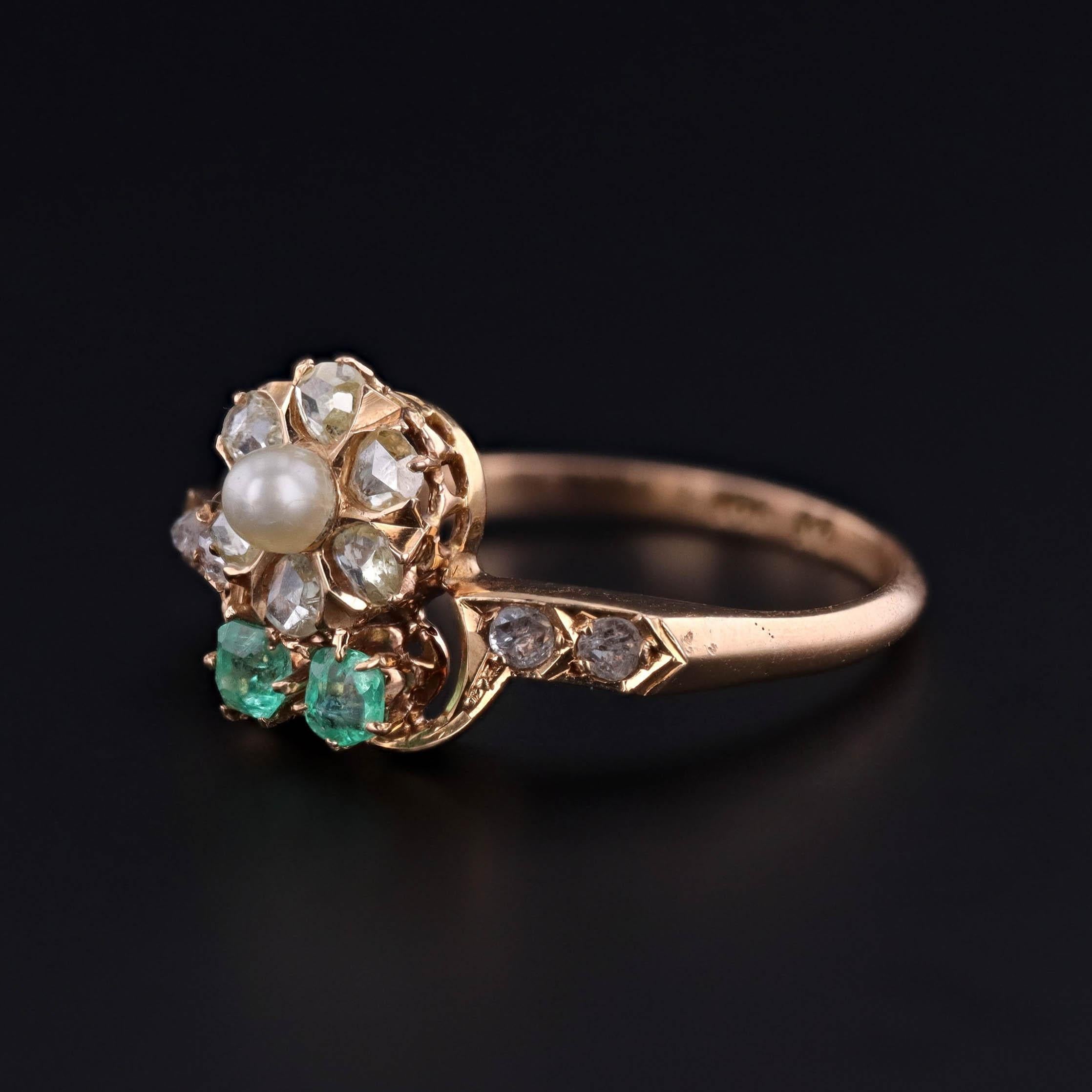 A Delicate Bloom of Belle Époque Elegance

This enchanting antique ring, circa 1900, captures the romanticism of the Belle Époque era with its delicate floral motif rendered in exquisite gemstones. The centerpiece is a charming daisy blossom—its