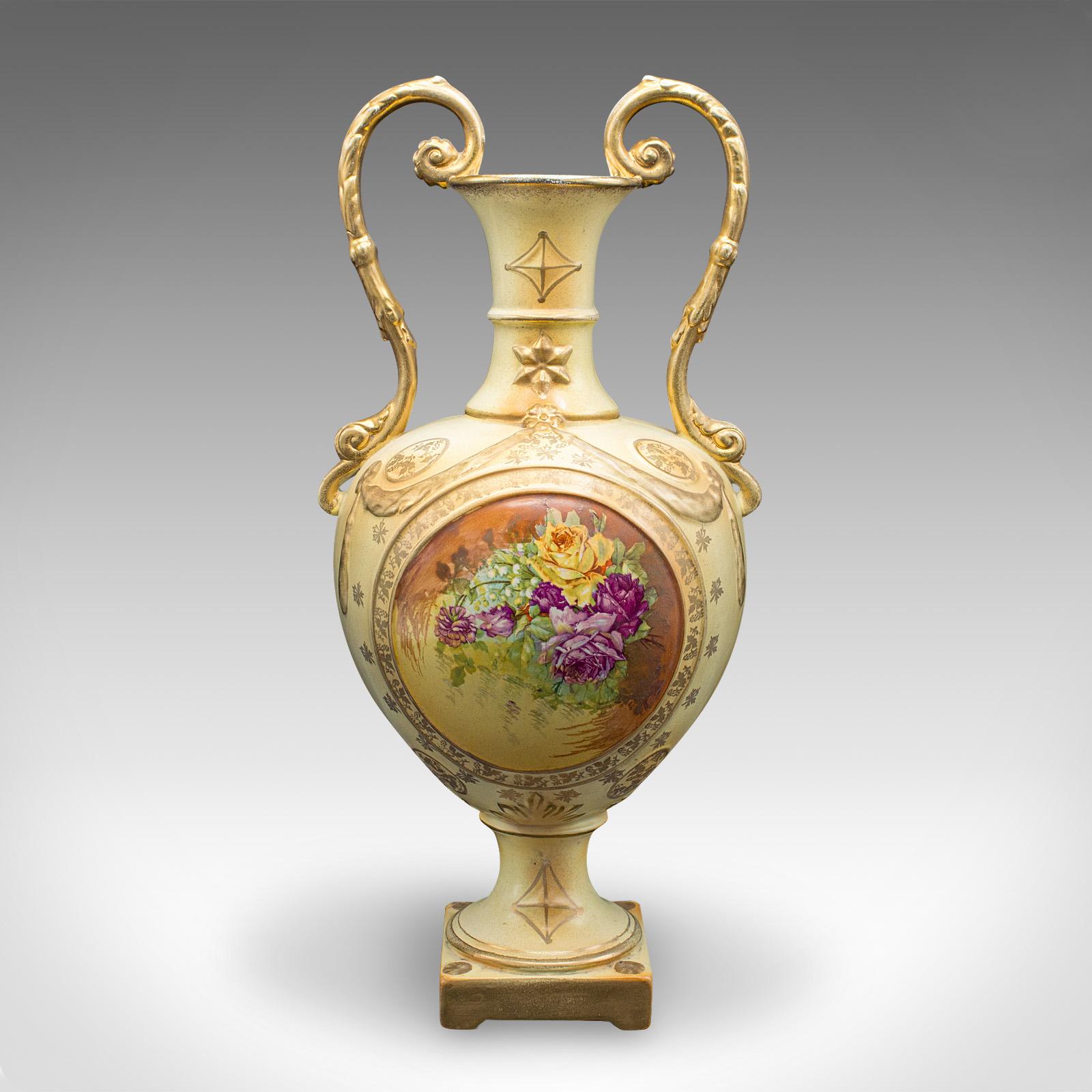 This is an antique flower vase. An English, ceramic baluster urn with Continental decor, dating to the early 20th century, circa 1920.

Attractive display vase with wonderful foliate decor
Displays a desirable aged patina and in good order
Ceramic