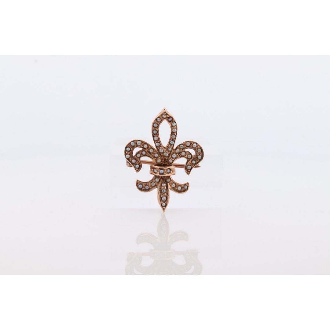 Vintage from the 19th century
Materials: Stone
Gemstone: Pearl

Style: Victorian

A neat Fluer de Lis brooch. Made before beginning of century.

Encrusted with Pearl seeds.

10k Rose Gold. Unmarked but test appropriately.

Size 27mm by 20mm
2.5