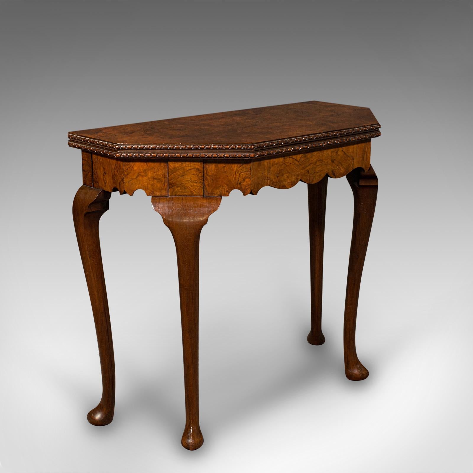 This is an antique fold-over card table. An English, burr walnut games table in Georgian revival taste, dating to the Edwardian period, circa 1910.

Graceful side table, folding out to reveal a delightful playing surface
Displays a desirable aged