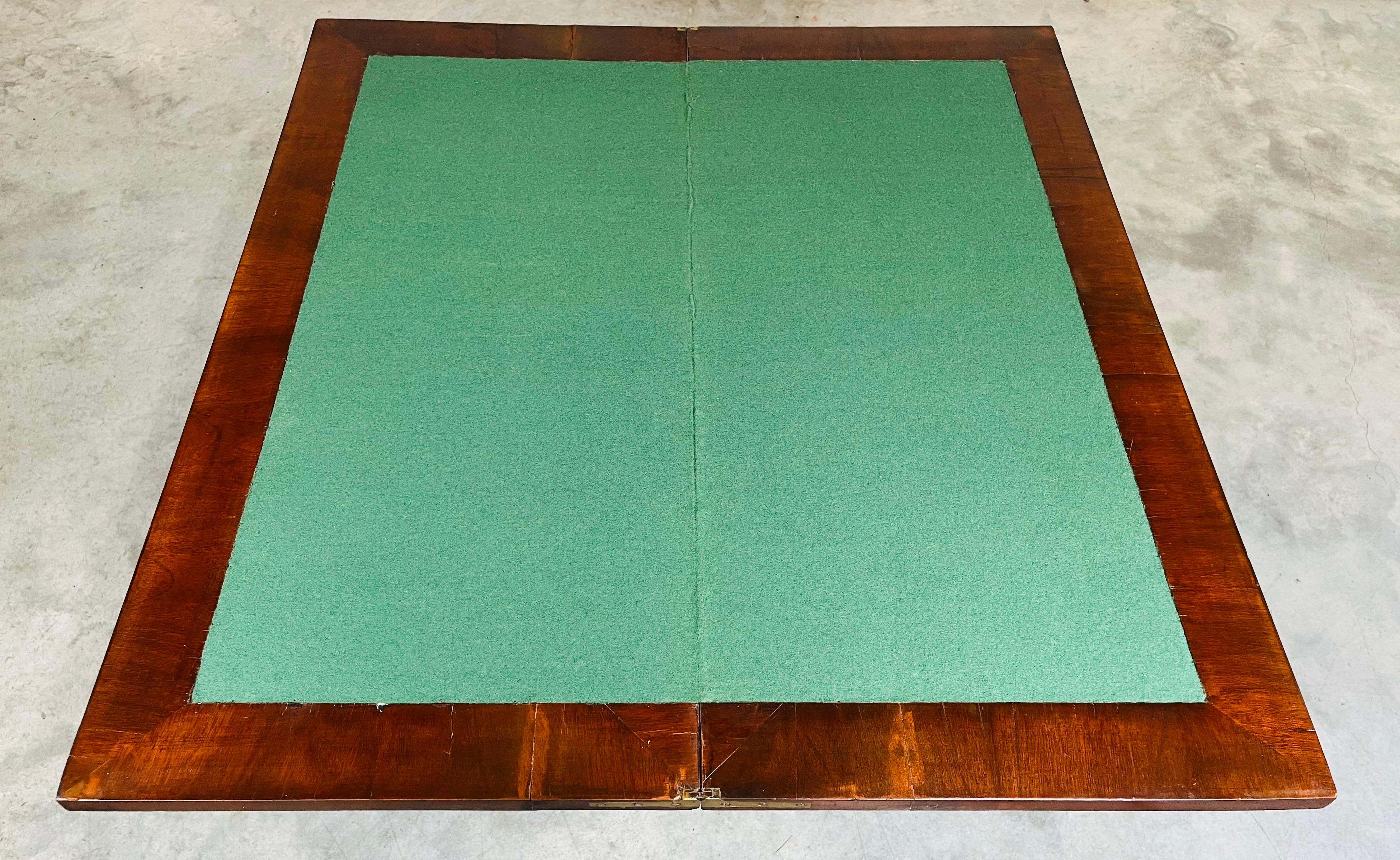 This is an antique fold-over card table. An English, mahogany and boxwood games or occasional table, dating to the Edwardian period, circa 1910.
Delightful folding card table with superb color.
Displays a desirable aged patina throughout.
Elegant