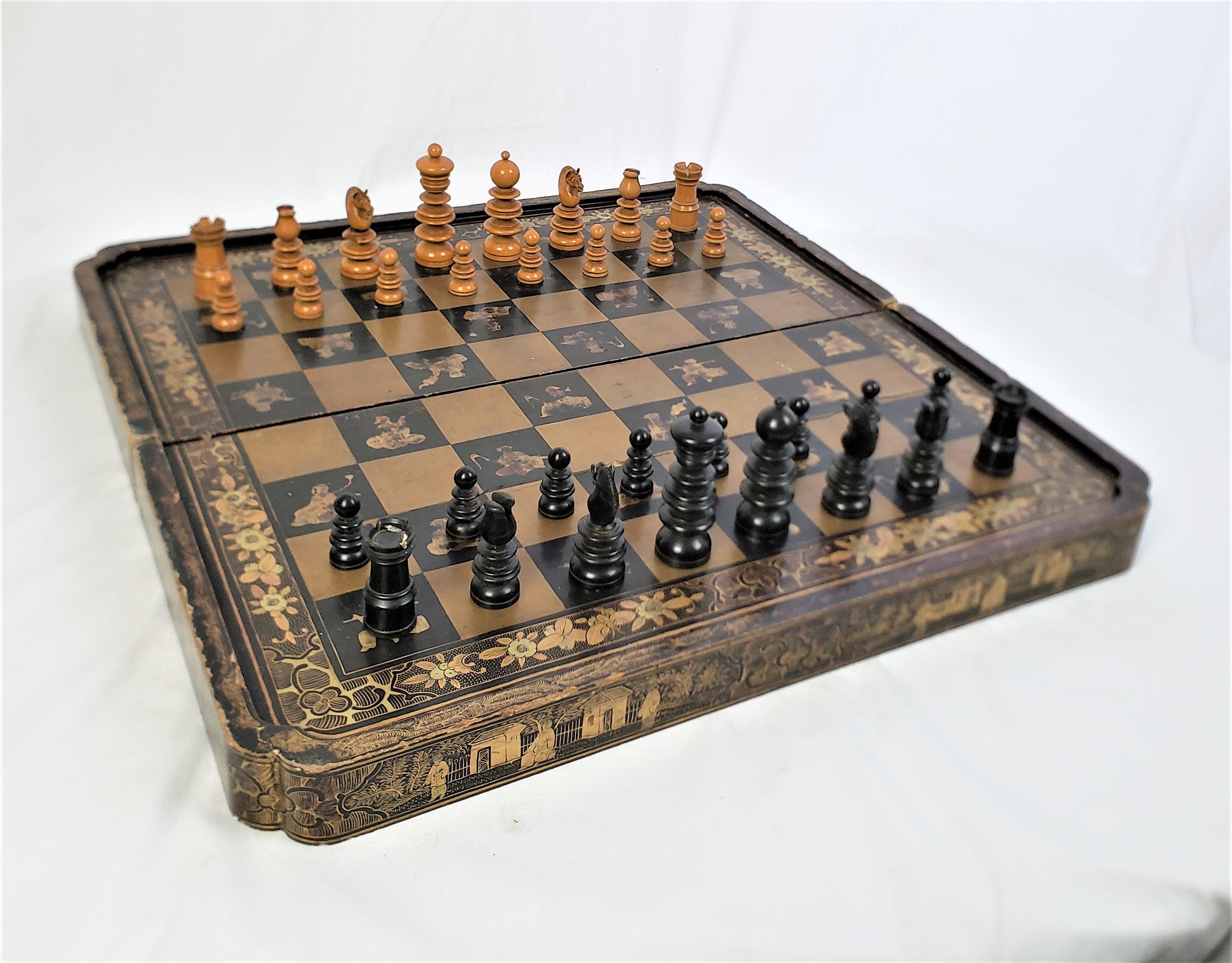 This antique games board and chess pieces are unsigned, but the board is presumed to have originated from China, dating to approximately 1850 and done in a Chinoiserie style and the pieces we believe originate from England. The board is composed of