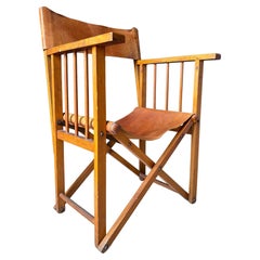 Silla de director antigua plegable de cuero y madera estilo safari colonial, años 30