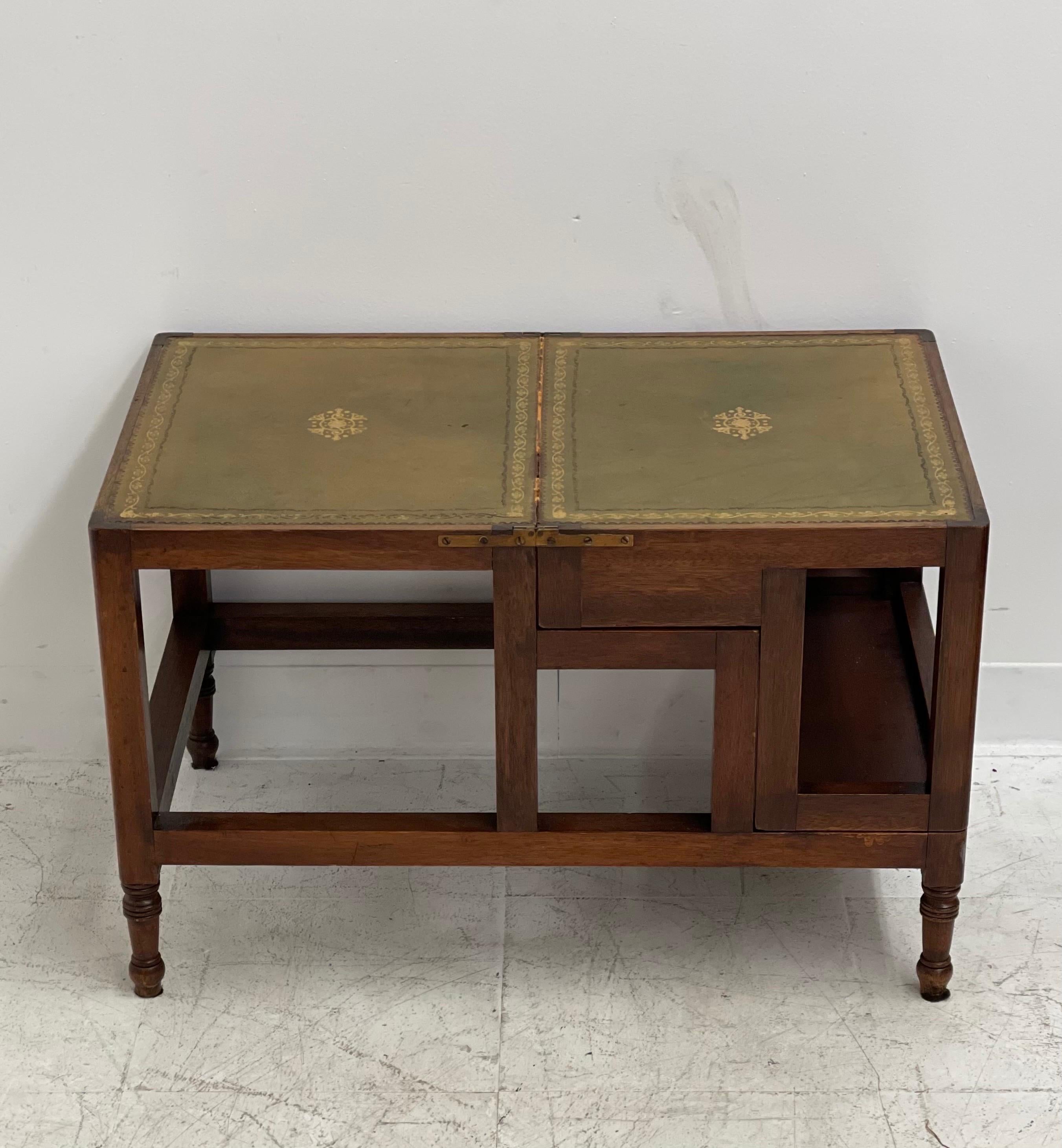 A George III design, mahogany four-step metamorphic library coffee table, with a naturally aged decorative gilt incised leather top and leathered steps opening to form a library step ladder.


Dimensions
Steps. 18 W ; 28 H ; 28 D
Table 28 W ;