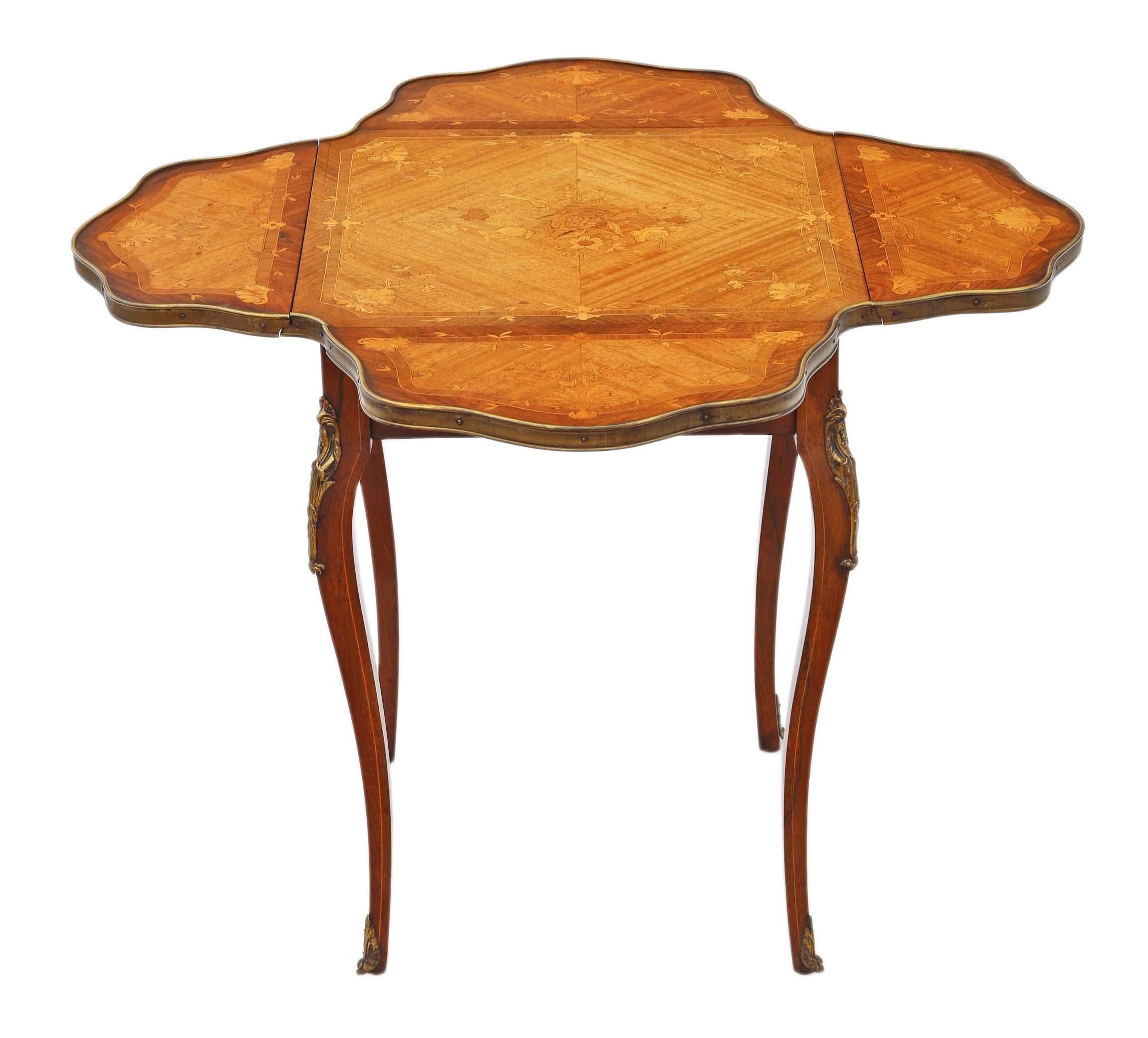 Folding marquetry centre, side or occasional table, circa 1900-1920
This is a lovely top quality table, that is full of age, charm and character. Brass edging and mounts.
Rare and attractive quality antique find.
The table has no loose joints and