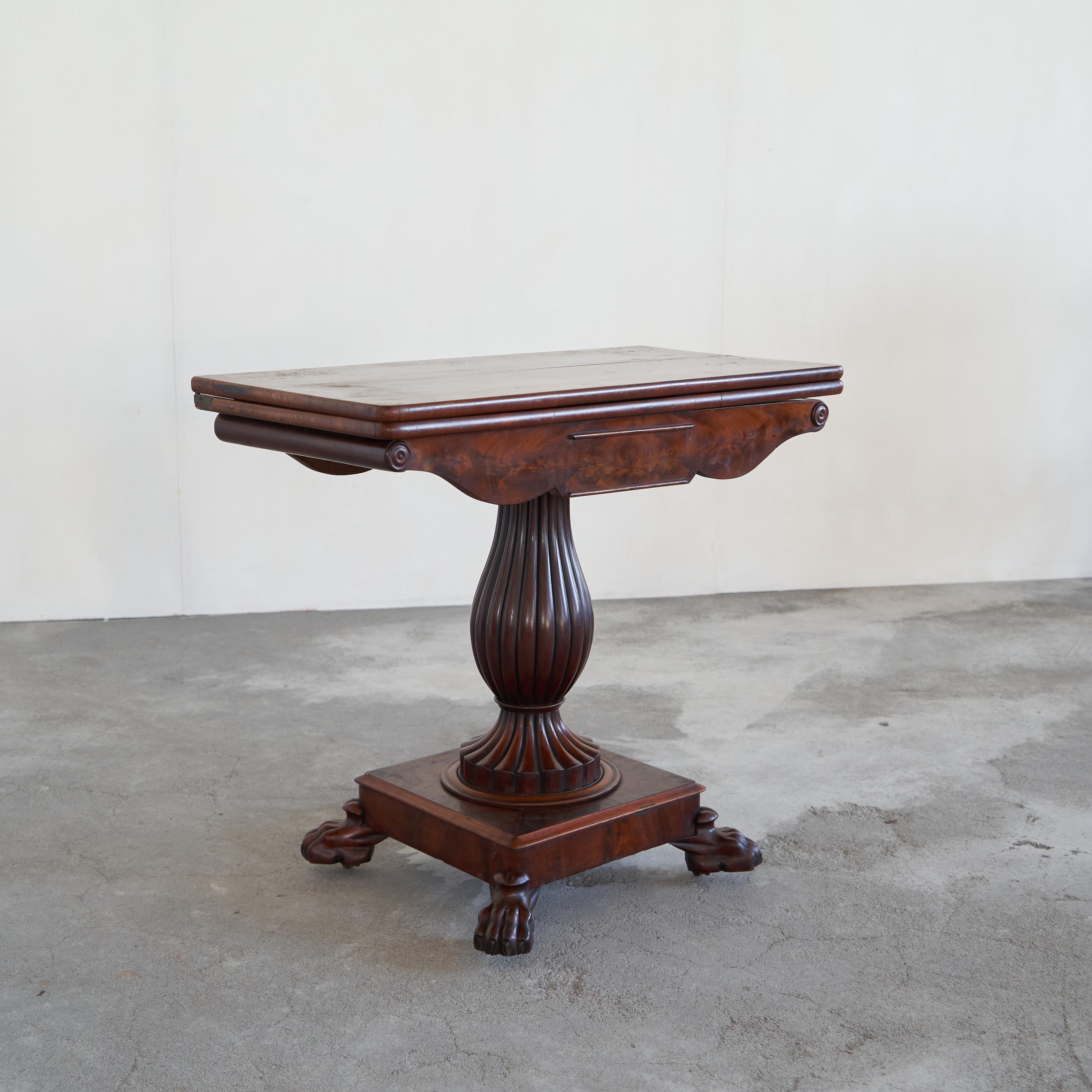 Antique Folding Pedestal Card Table, Mid 19th Century.

This is a wonderful folding card table with a very distinct pedestal base. Made in the middle of the 19th century, this is a true antique with a desirable appearance. Great details like the