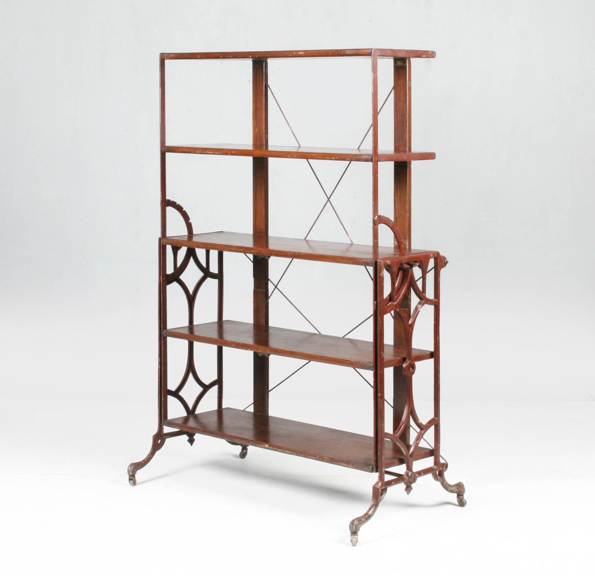Antique folding shelf / table. Cast iron frame and oak shelves. Patented by Boeckh Brothers. This shelf / table were used to prepare and arrange the brushes and pigments.

Origin:
Canada, 1900-1910

Dimensions:
Shelf position 145 x 96 x