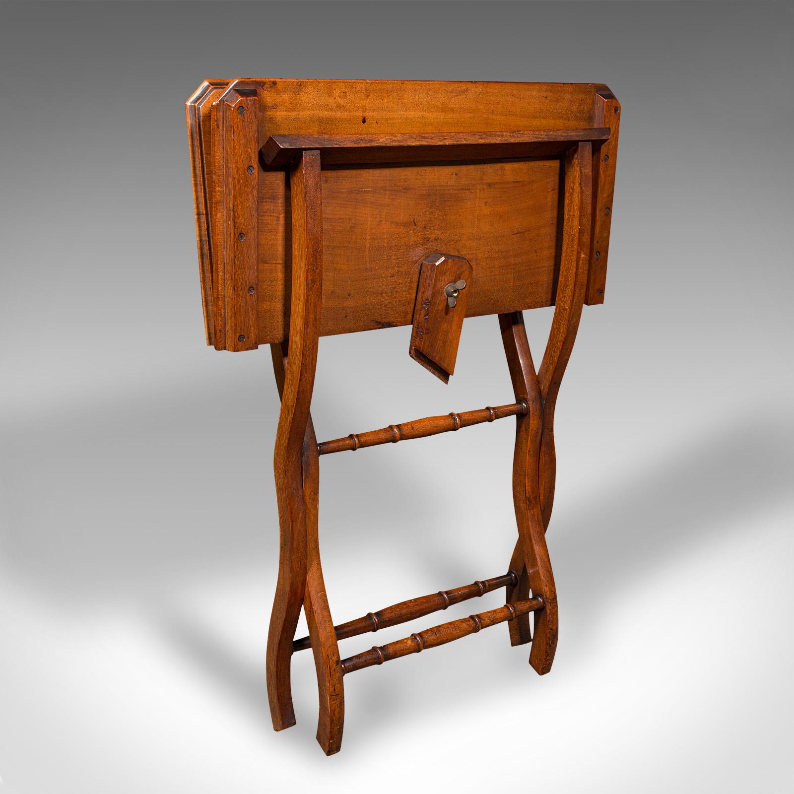 This is an antique folding writing table. An English, walnut carriage, side or serving table, dating to the Victorian period, circa 1880.

Graceful and interesting, with wonderful versatility for any room
Displays a desirable aged patina and in