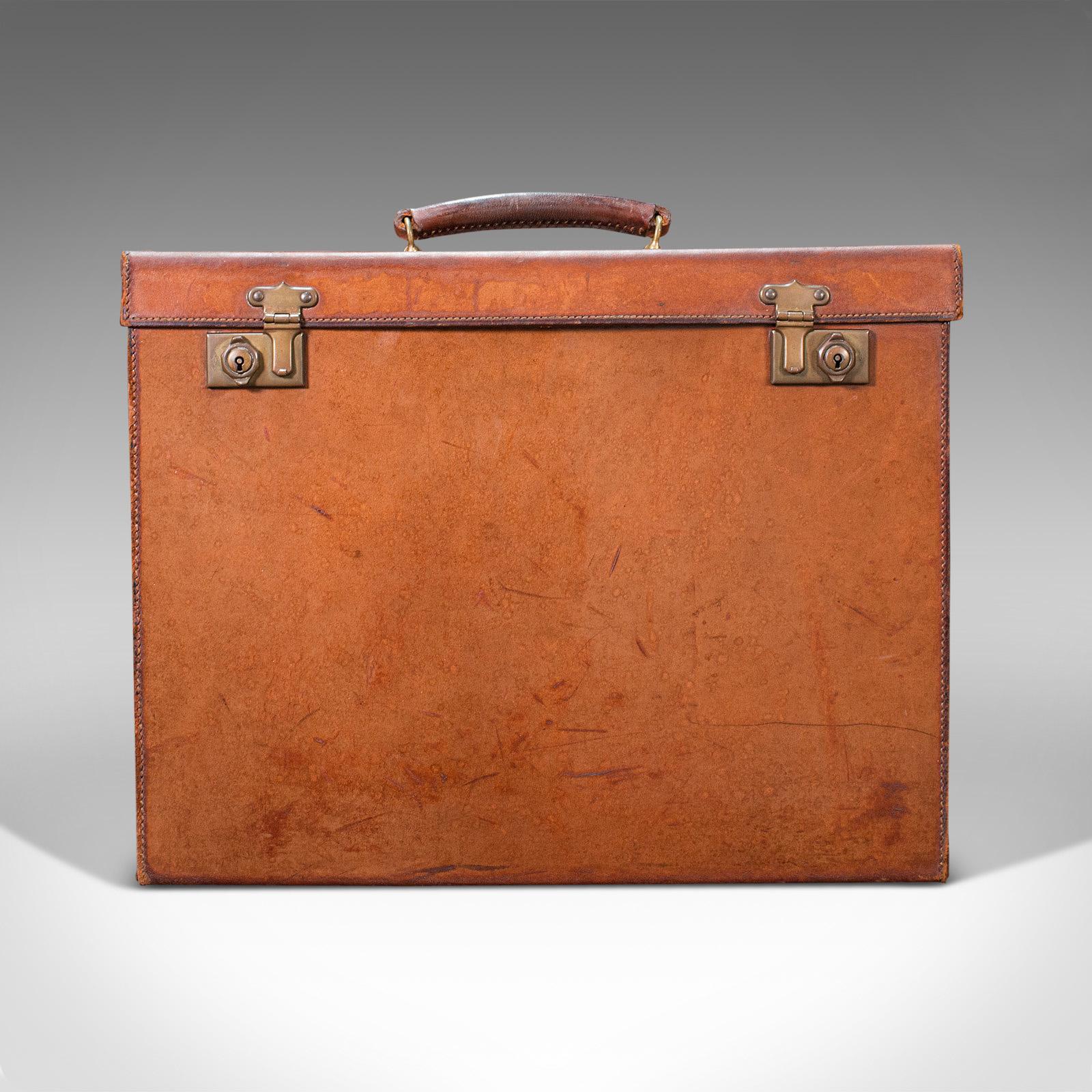 This is an antique leather folio case. An English, leather record producer's attache briefcase, dating to the early 20th century, circa 1920.

Fascinating folio case with useful dimensions for lovers of music
Displays a desirable aged patina and