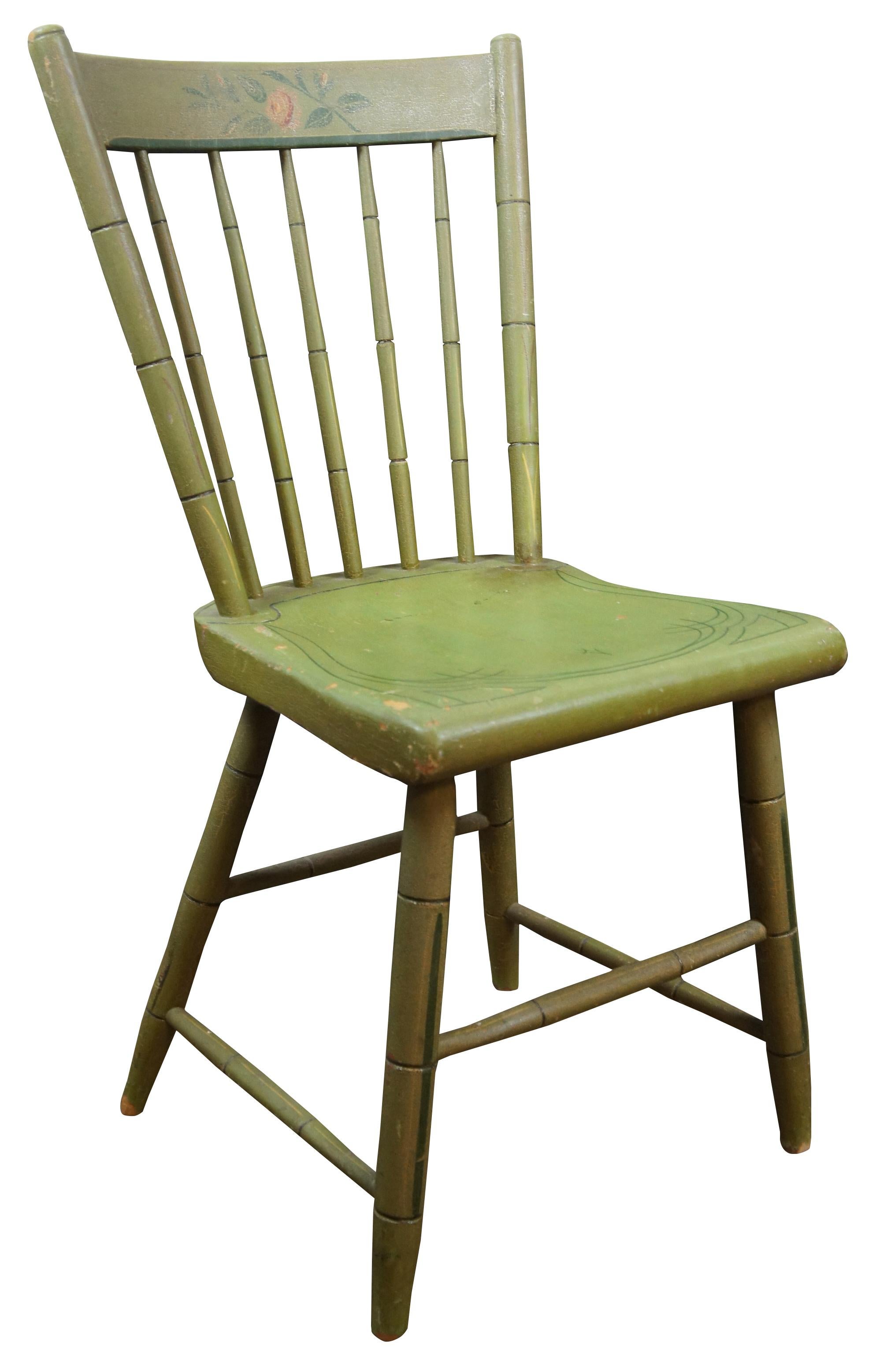 Antique Hitchcock style Windsor spindle back side chair painted green with a pink rose accent.
  