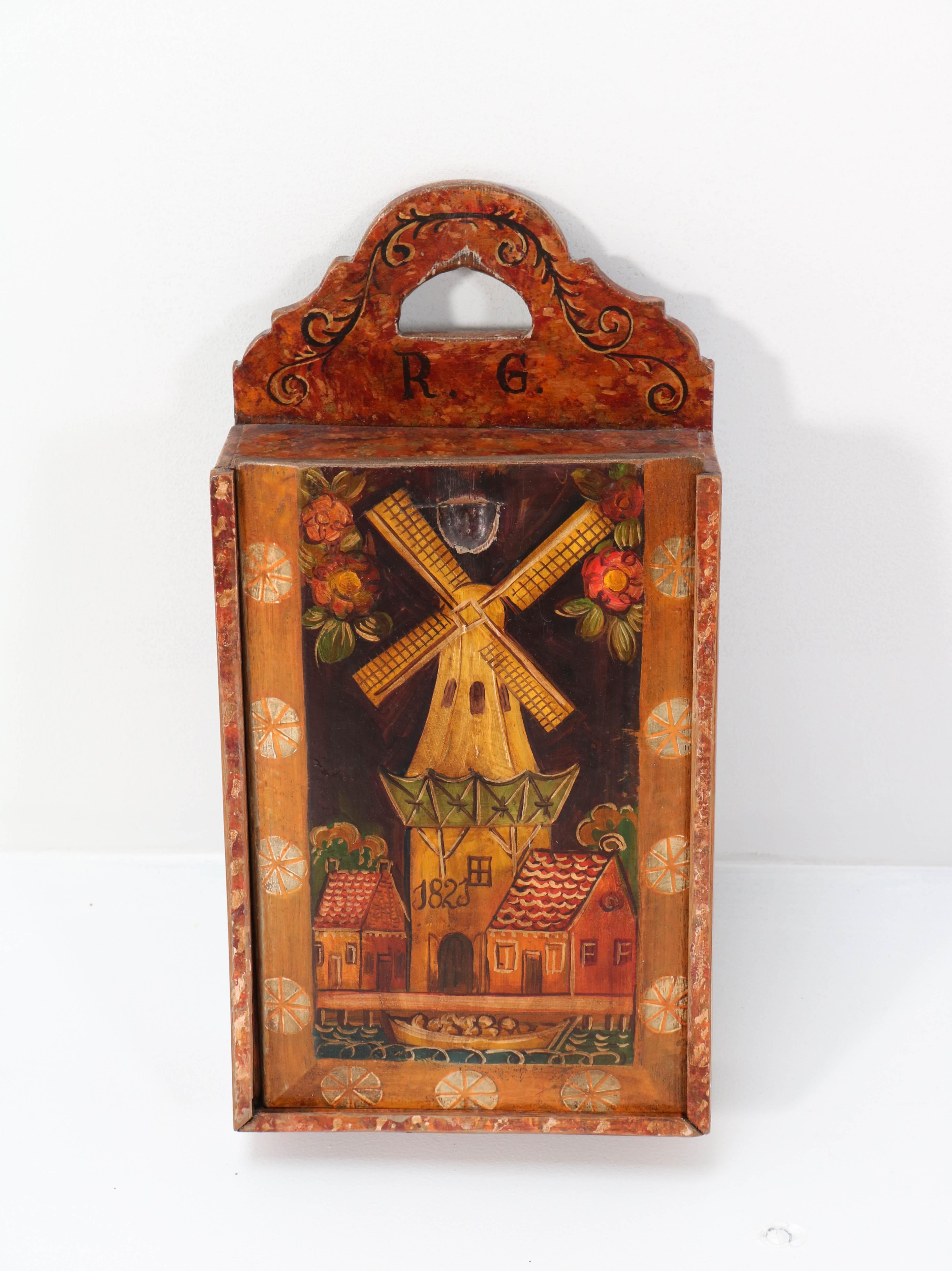 Magnificent and rare Antique Folk Art school box.
Striking Dutch design from 1823.
Hand-painted in Hindeloopen style.
Ultra rare with the image of the Dutch wind mill!
Almost 200 years old and in top condition with a beautiful patina!
     