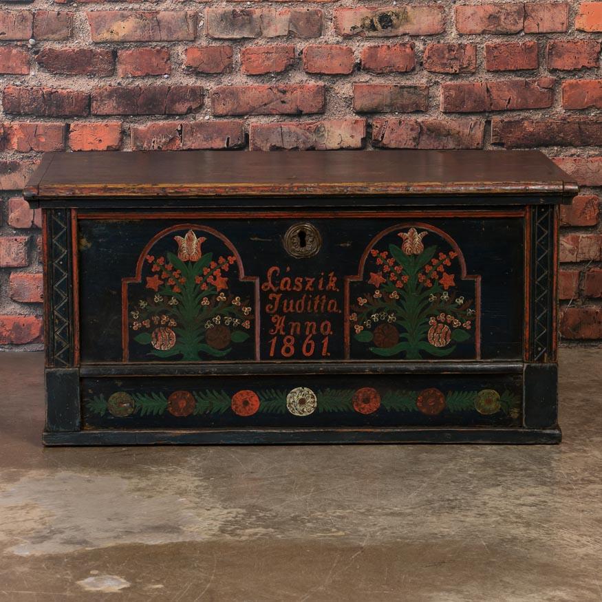 This trunk is a special find due to its size and superb original paint which has been well preserved over 150 years of use. The deep blue background and delightful floral details are wonderful examples of the traditional painting style in rural E.