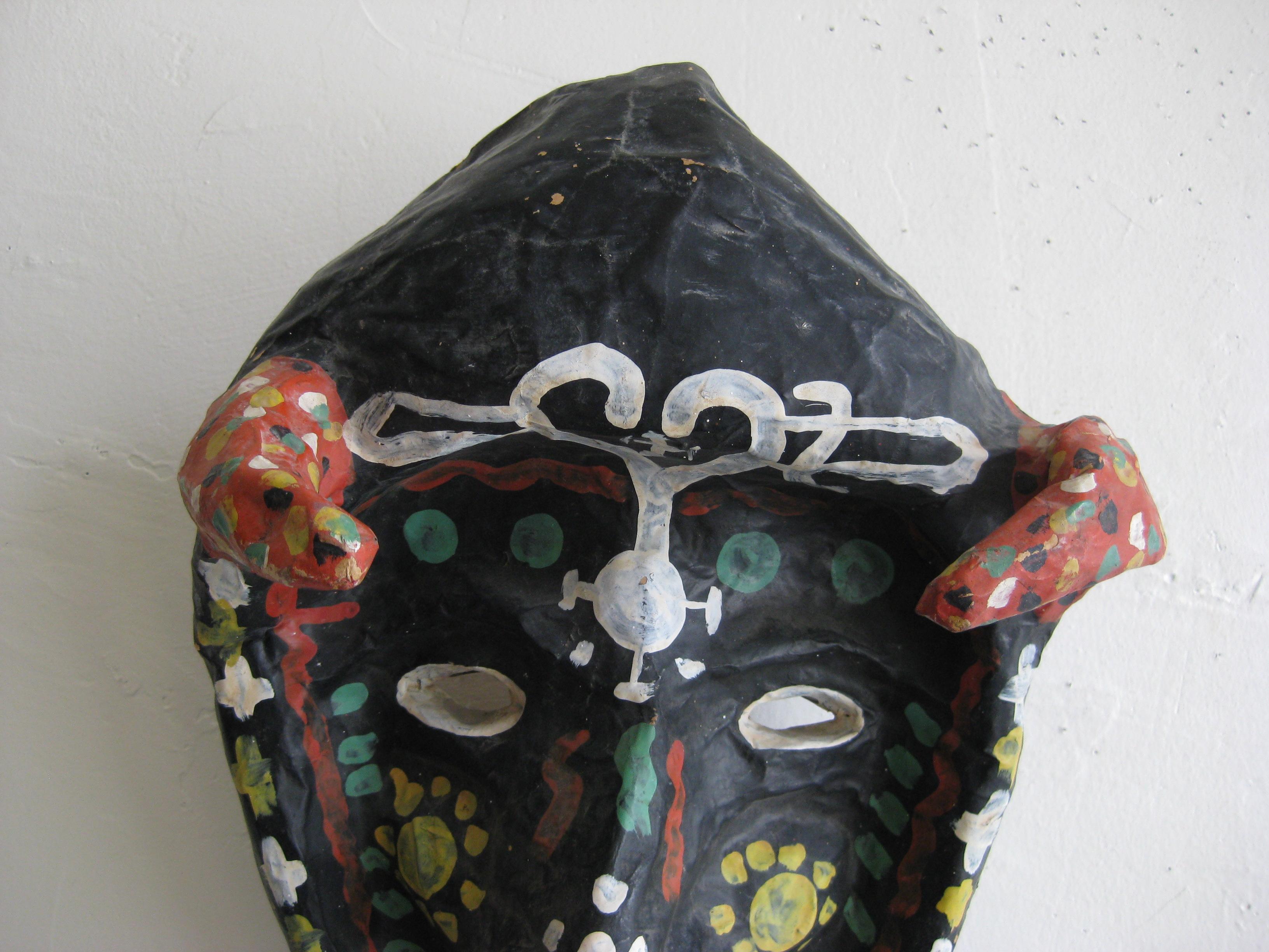 Very unique antique handmade folk art papier/paper mâché Mardi Gras/Halloween voodoo costume mask. The mask is handmade and painted by the artist. Signed 