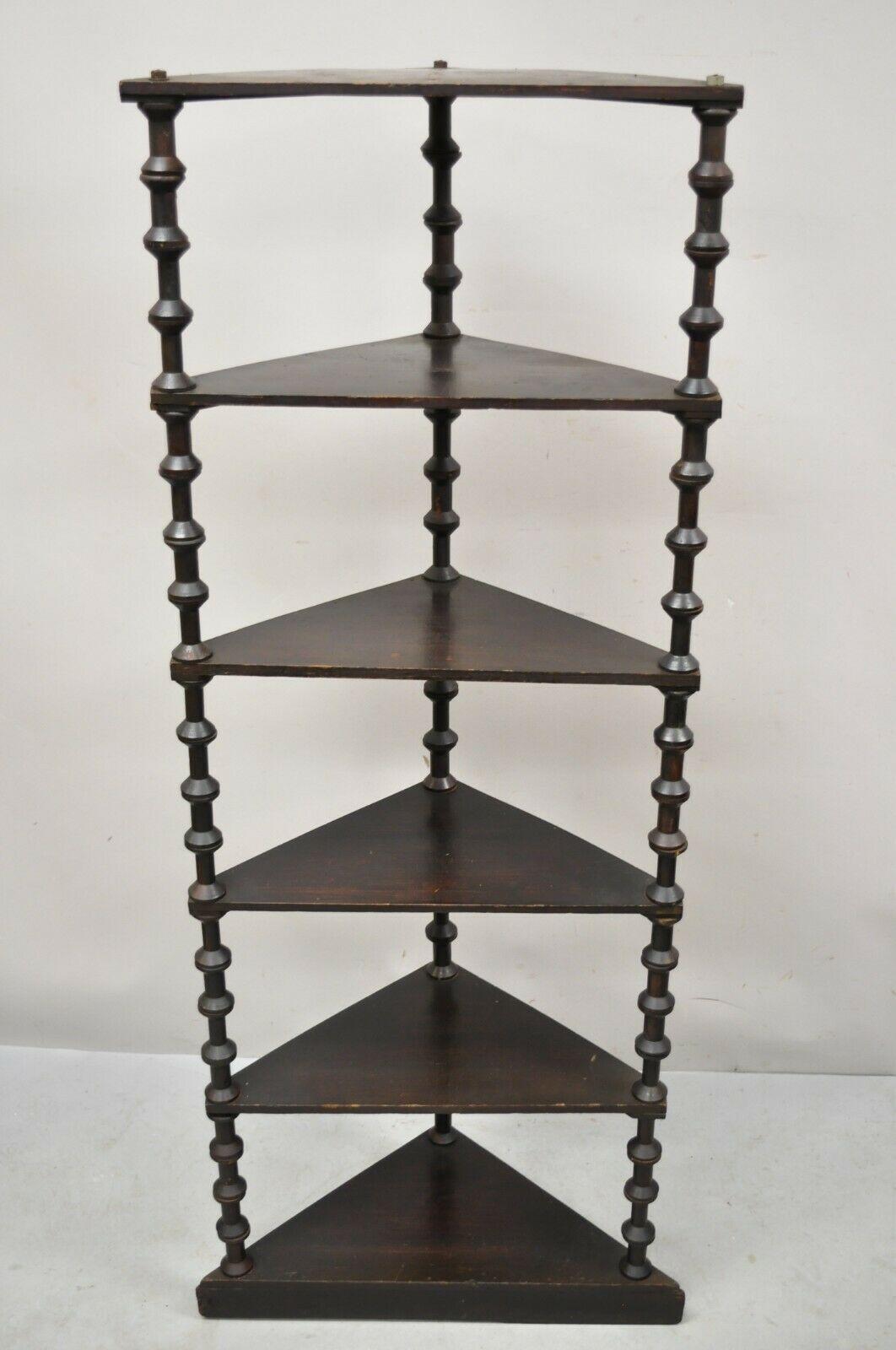 Antique folk art sewing spool carved 6 tier corner shelf whatnot stand. Item features beautiful wood grain, nicely carved details, very nice antique item, quality American craftsmanship. Circa Early 1900s. Measurements: 60