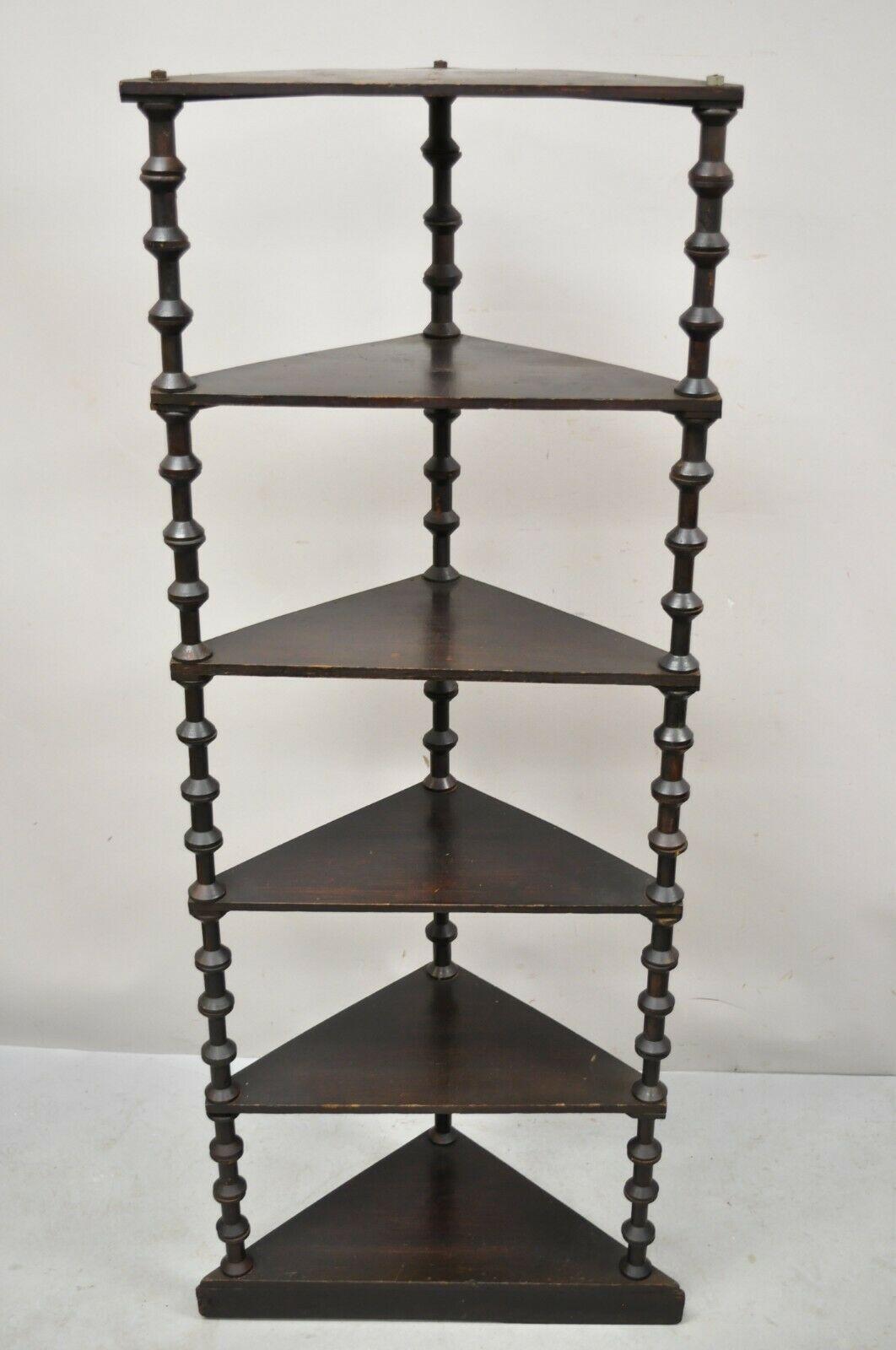 Antique folk art sewing spool carved 6 tier corner shelf whatnot stand. Item features beautiful wood grain, nicely carved details, very nice antique item, quality American craftsmanship. Circa Early 1900s. Measurements: 60