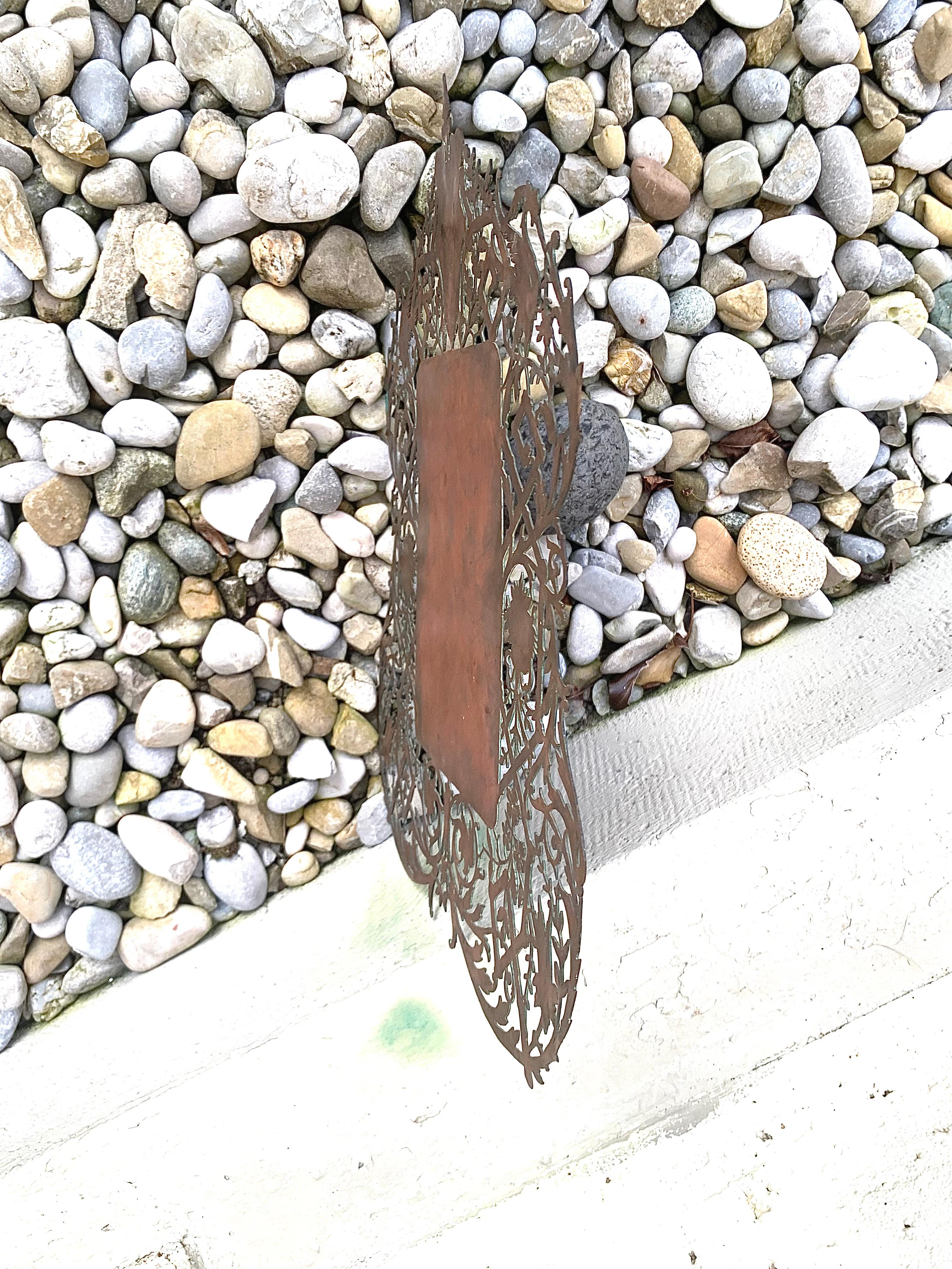 This unusual ornamental copper plate was used to write information on it, possibly the menue for a restaurant.  We can see traces of writing.
The beautifull carving shows birds, leaves and flowers  