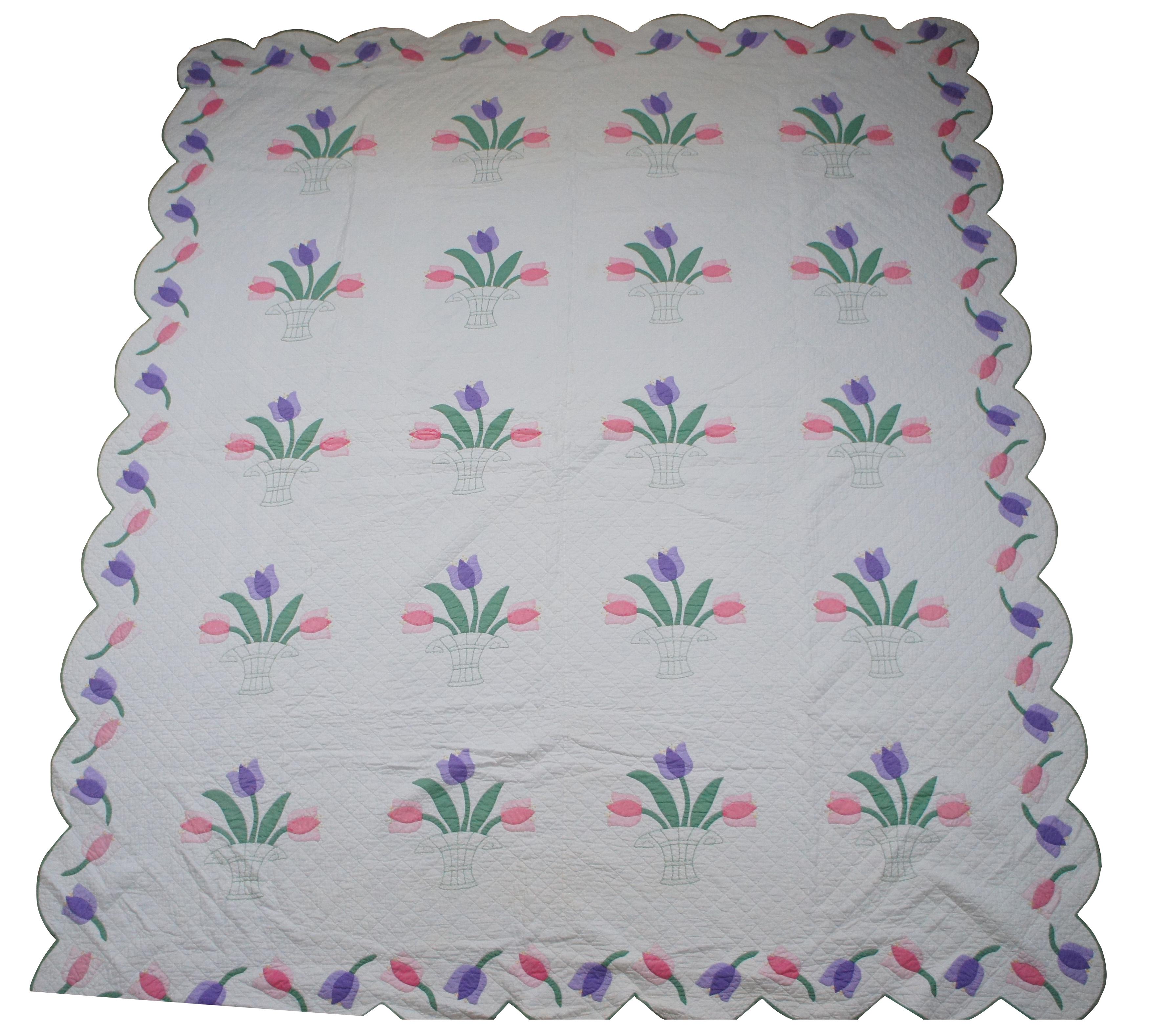 Vintage hand stitched white bedspread / blanket / coverlet / quilt with applique pink and purple tulips in embroidered baskets and loose tulips along the scalloped edge. Measure: 93