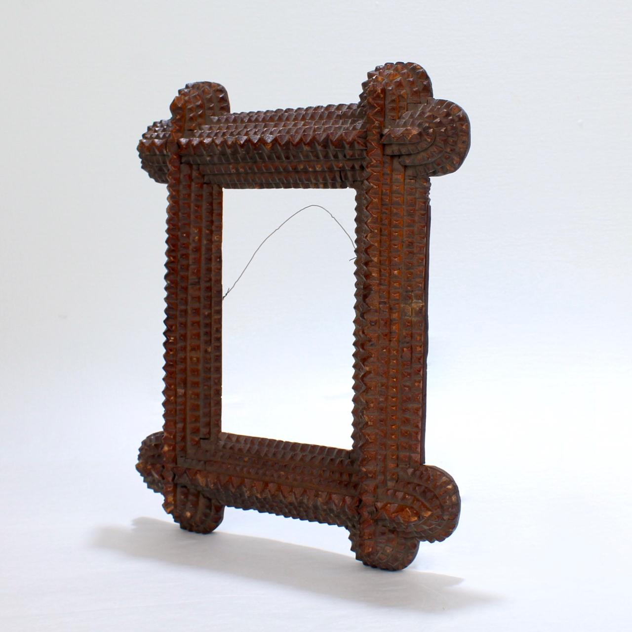 A wonderful antique Tramp Art picture frame. 

With five levels and a good, old red/brown wash finish.

A wonderful Folk Art frame!

Width ca. 8 in.
Length ca. 10 in.
Depth ca. 1 5/8 in.
Sight width just over 3 1/4 in.
Sight length just