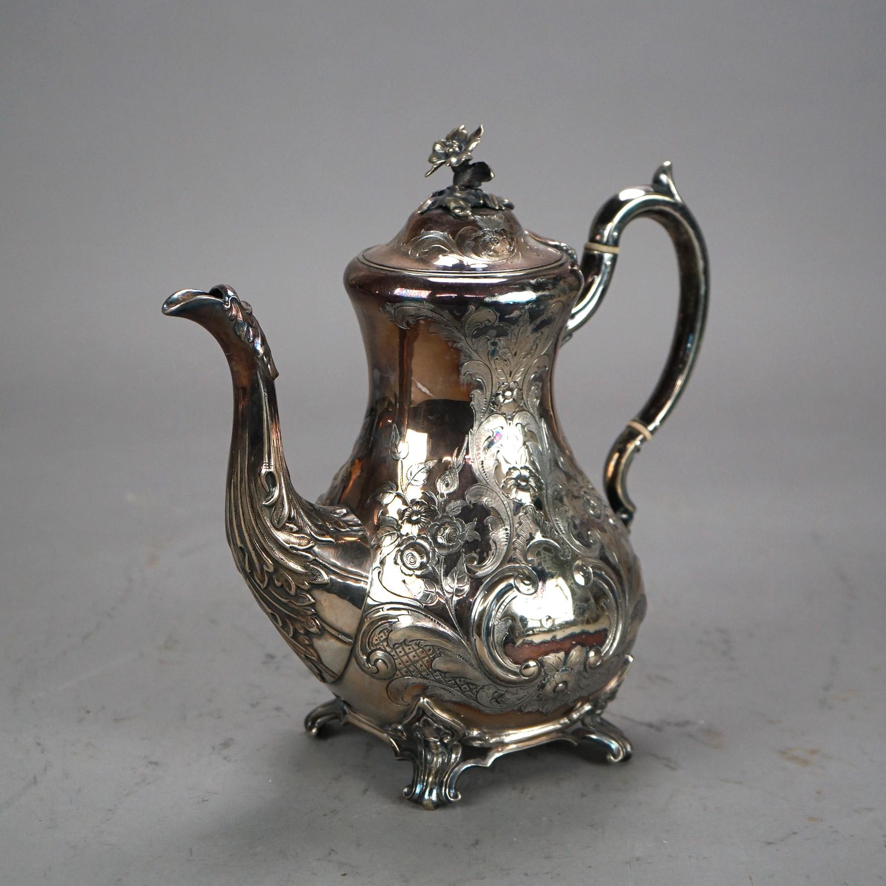 Ancienne théière à pied James Dixon And Sons Sheffield en métal argenté avec gravure de feuillage et fleuron C1890

Dimensions - 10,25 