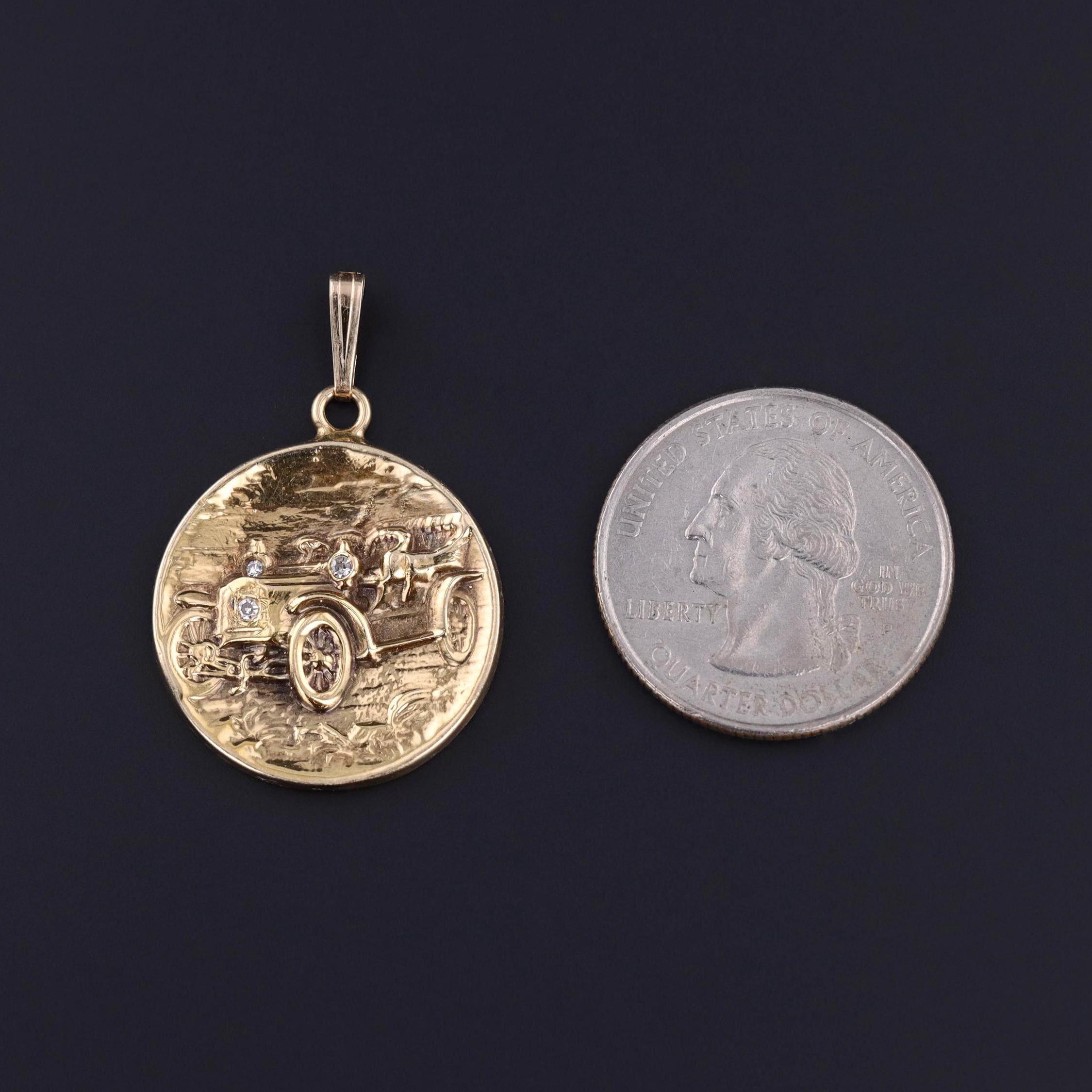 Antique Car Pendant: This antique pendant (c. 1910) depicts a Ford Model B of 14k gold with three diamond accents.

The piece measures 1.4 inches from the top of the bail to bottom by 0.9 inches wide and weighs 6.56 grams. It is in great