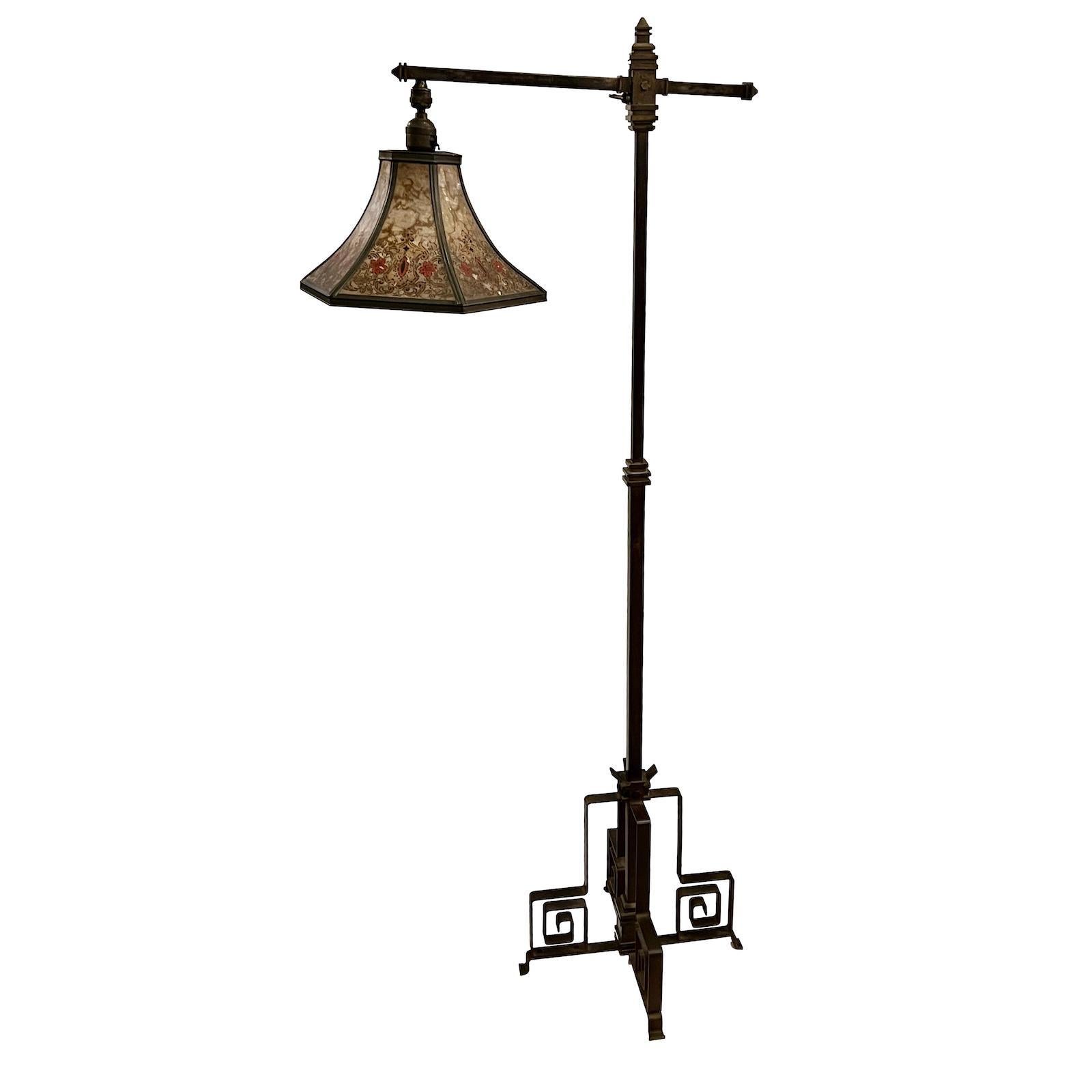 A circa 1900 English iron floor lamp with original mica shade.

Measurements:
Height: 57