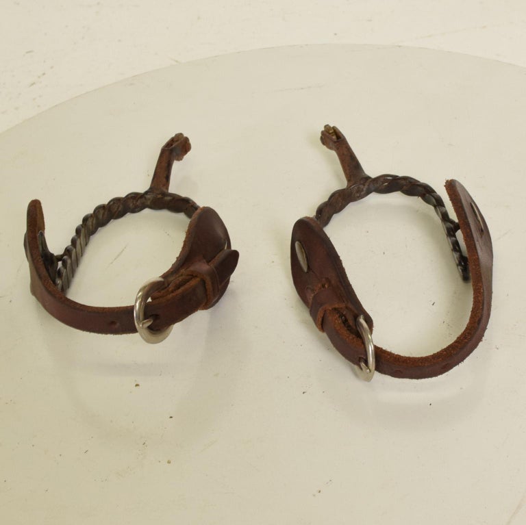 Antique Iron Western Spurs with Leather and Brass Accent For Sale at 1stDibs