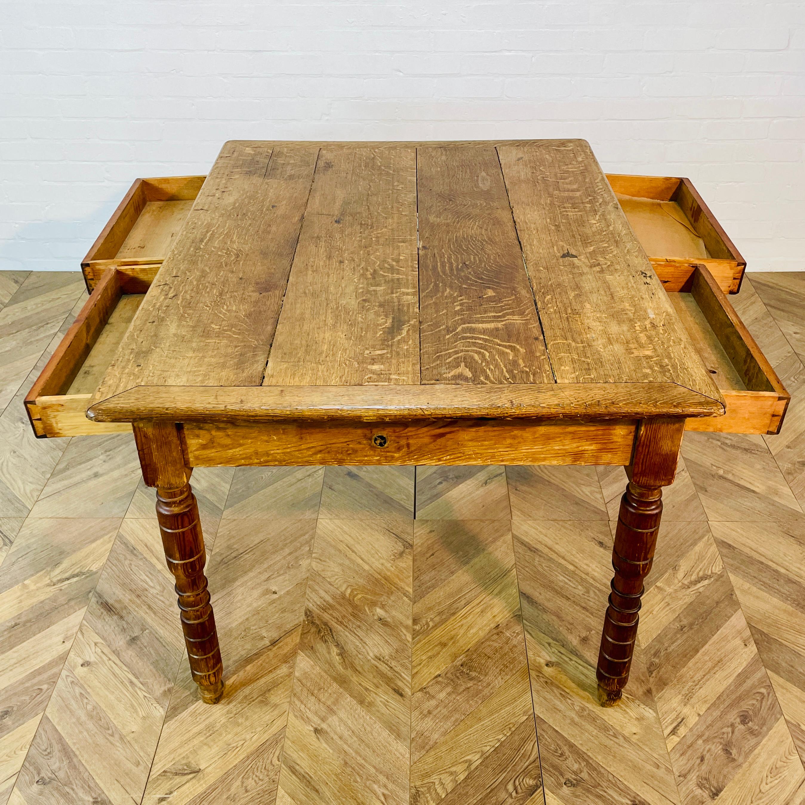 A Beautiful Antique Pine Table with Four Drawers, Two Drawers with Brass Handles on Each Side, Early 19th Century.

The table was originally curated from a monastery in Sweden and was formerly a rectory table.

The table is in good antique condition
