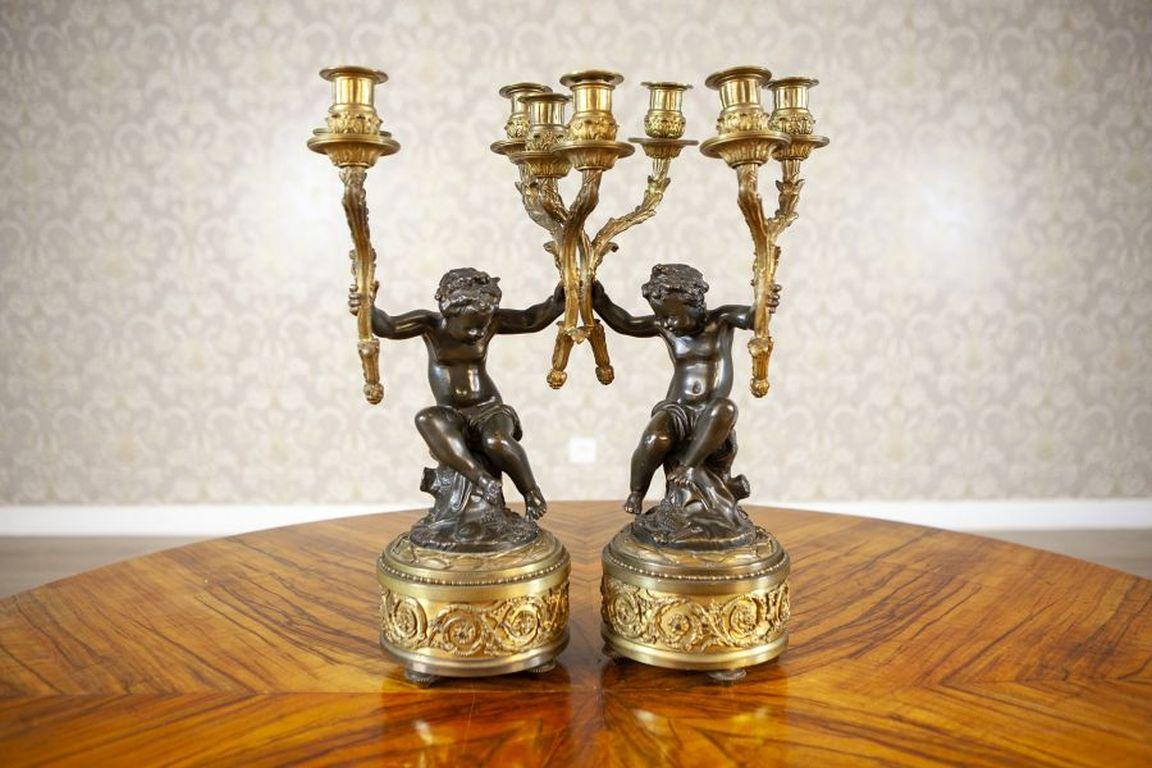 Two 19th-Century Bronze Four-Armed Candelabras

Two 19th-century four-armed candelabras with putti from the period of 1840-1850 in the Napoleon III style. Putti made of bronze, other elements made of brass. The candelabras are also available on our